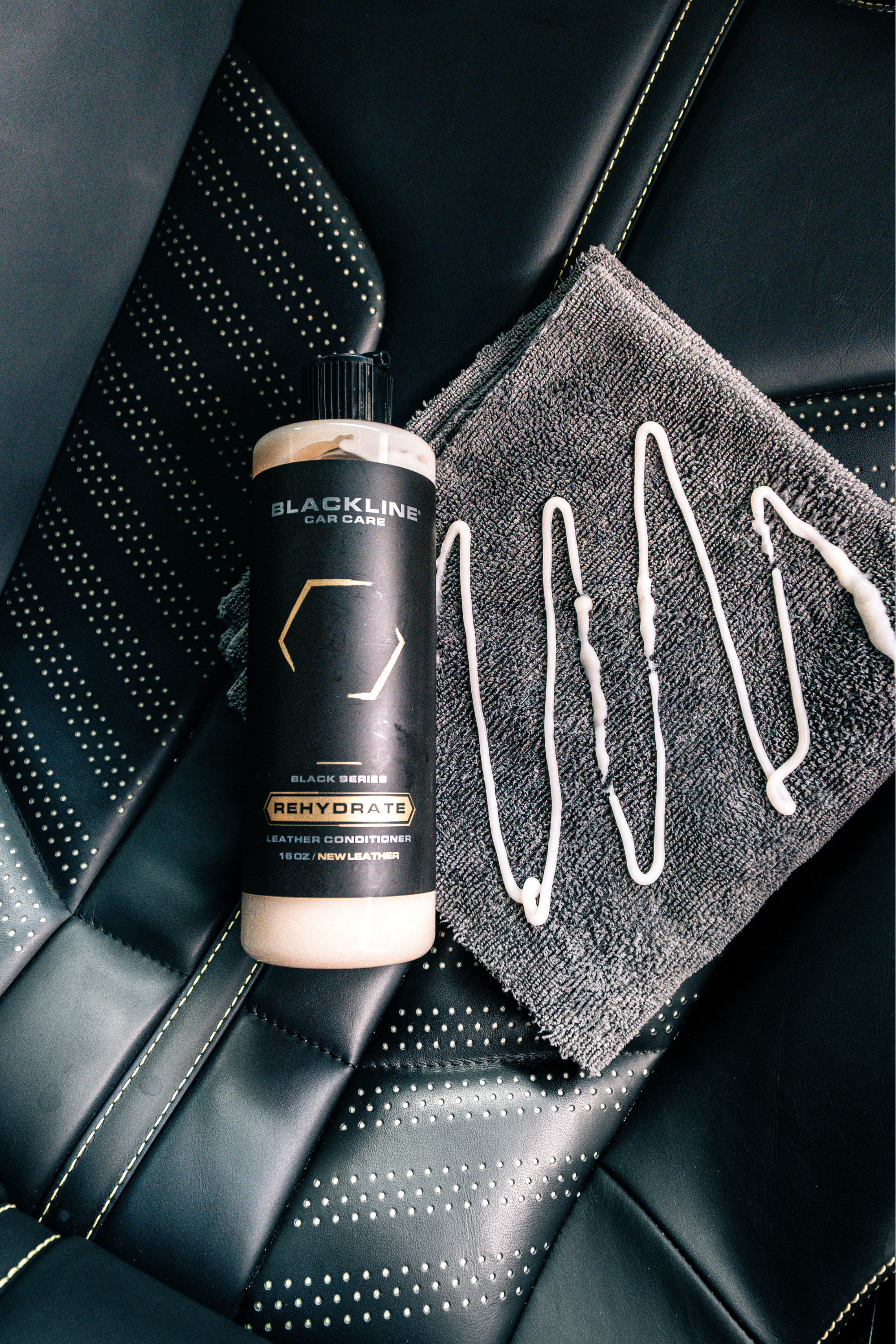 Blackline Car Care Blackline® Rehydrate Leather Conditioner bottle, a leather conditioner for car interiors.
