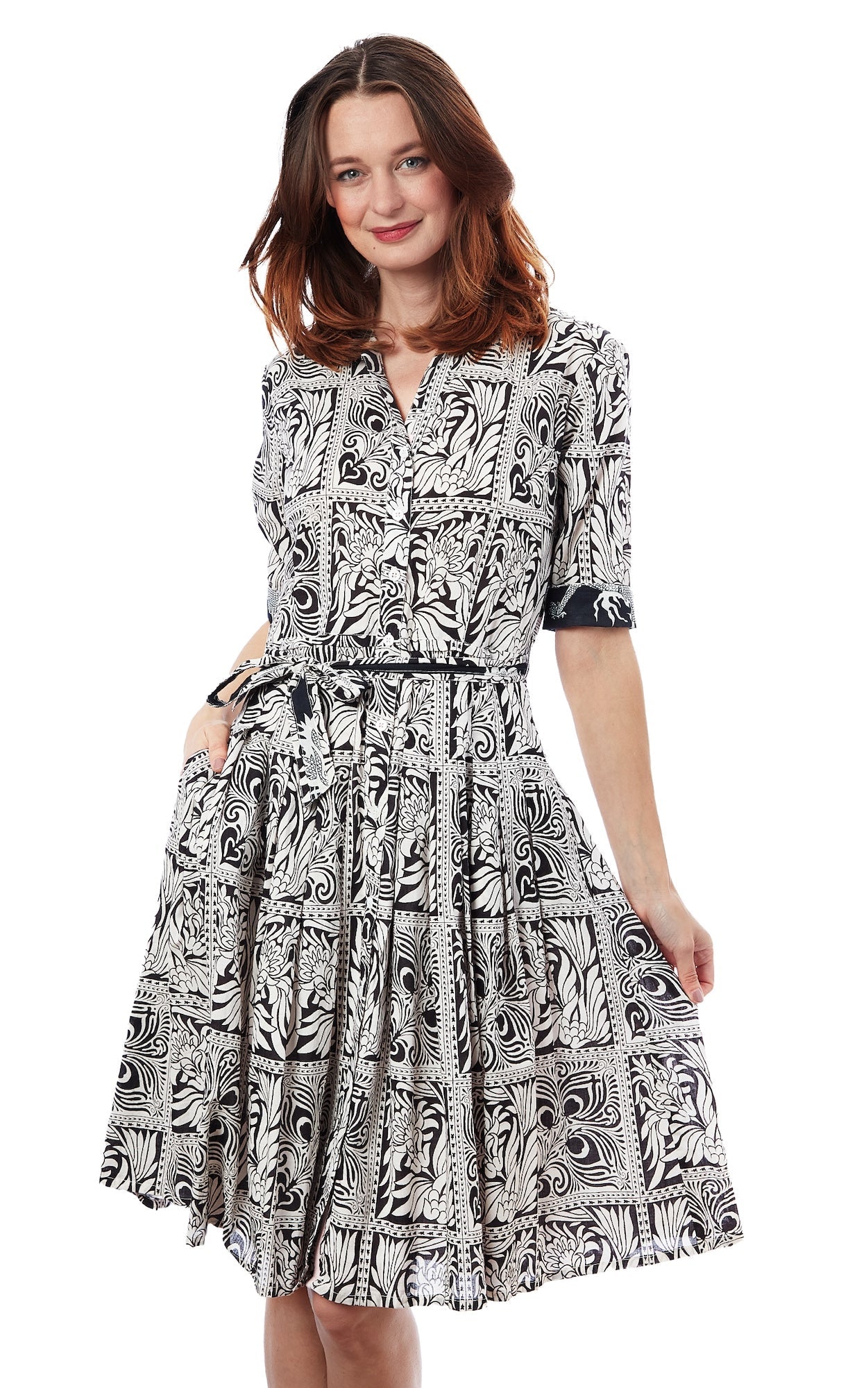 Dizzy-Lizzie Mrs Maisel black and white geometric print dress displayed on a hanger.