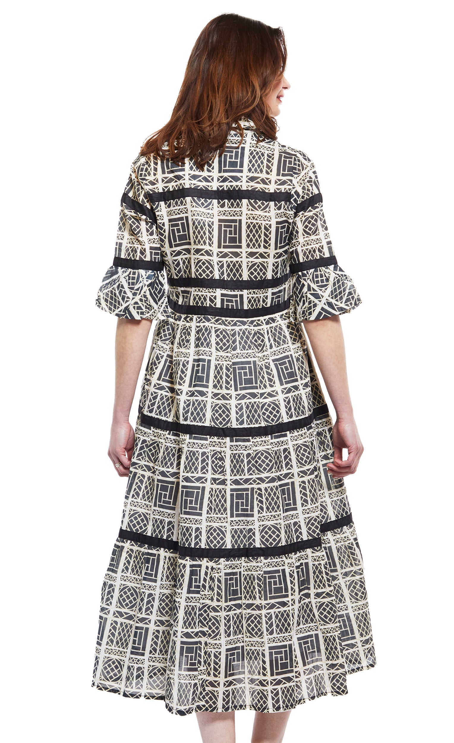 Dizzy-Lizzie Miami Style midi dress with black and white wicker pattern, flounce and ribbon details, perfect for summer fashion.