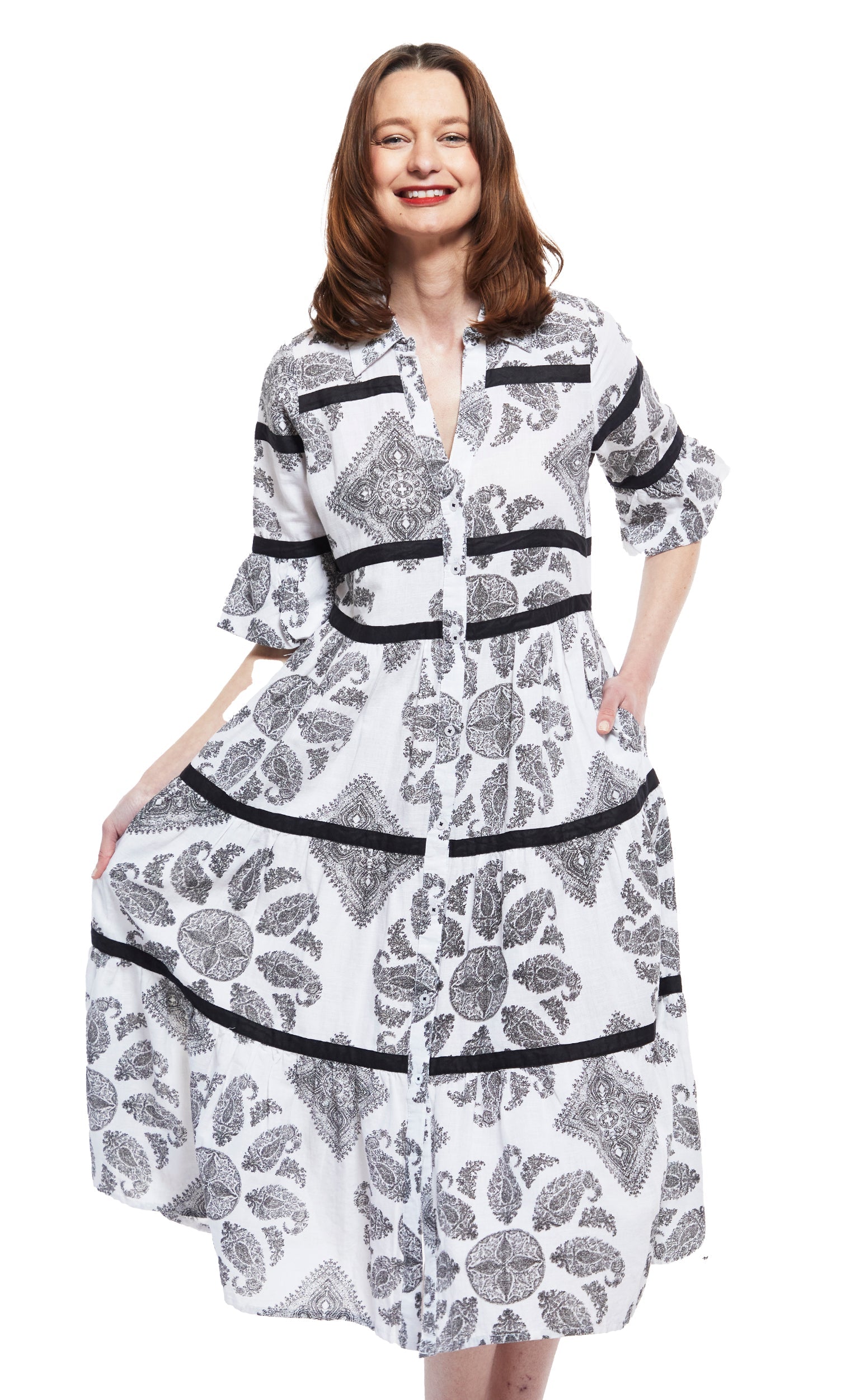 Dizzy-Lizzie Miami Style midi dress with flounce and black ribbons, featuring black and white paisley pattern.
