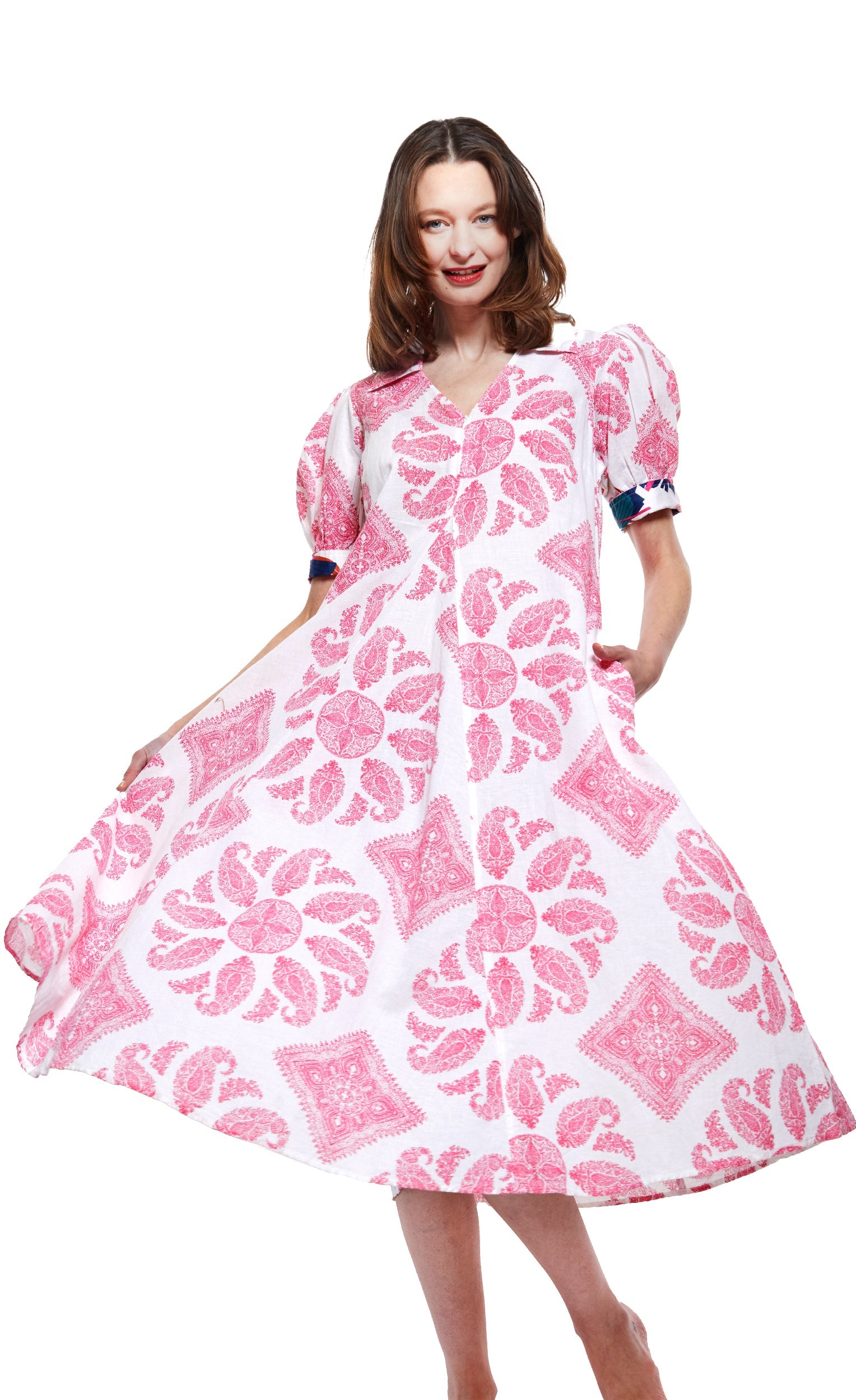 Dizzy-Lizzie Montauk Dress in pink and white paisley pattern, flowy sleeveless dress with a relaxed fit and ruffled hem.