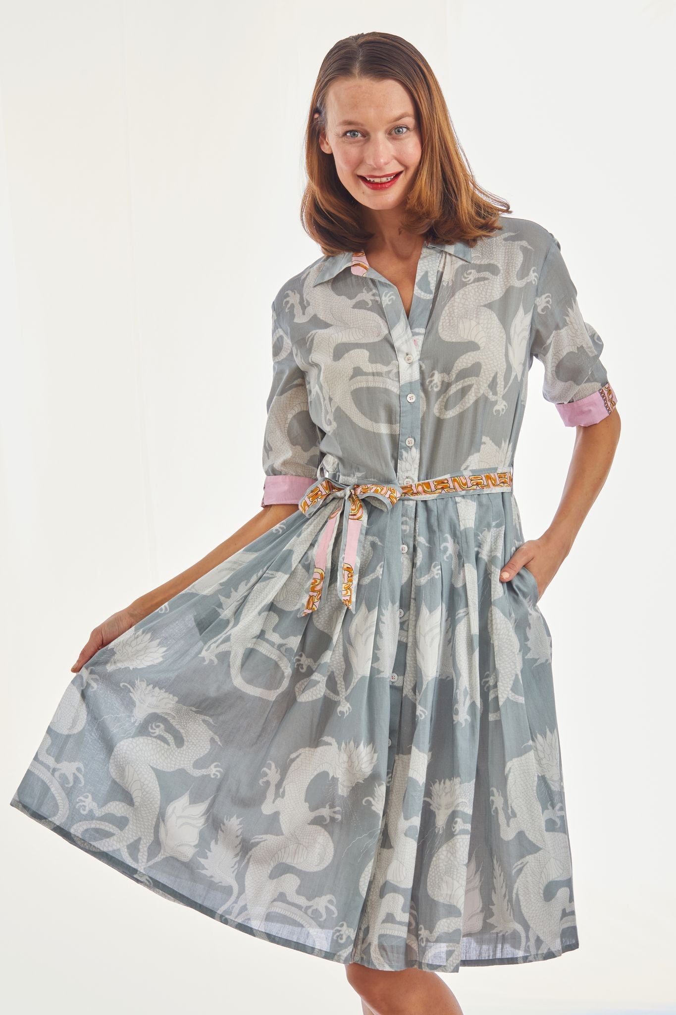 Dizzy-Lizzie Mrs. Maisel grey dress with dragon pattern, stylish and elegant, shown on a mannequin.