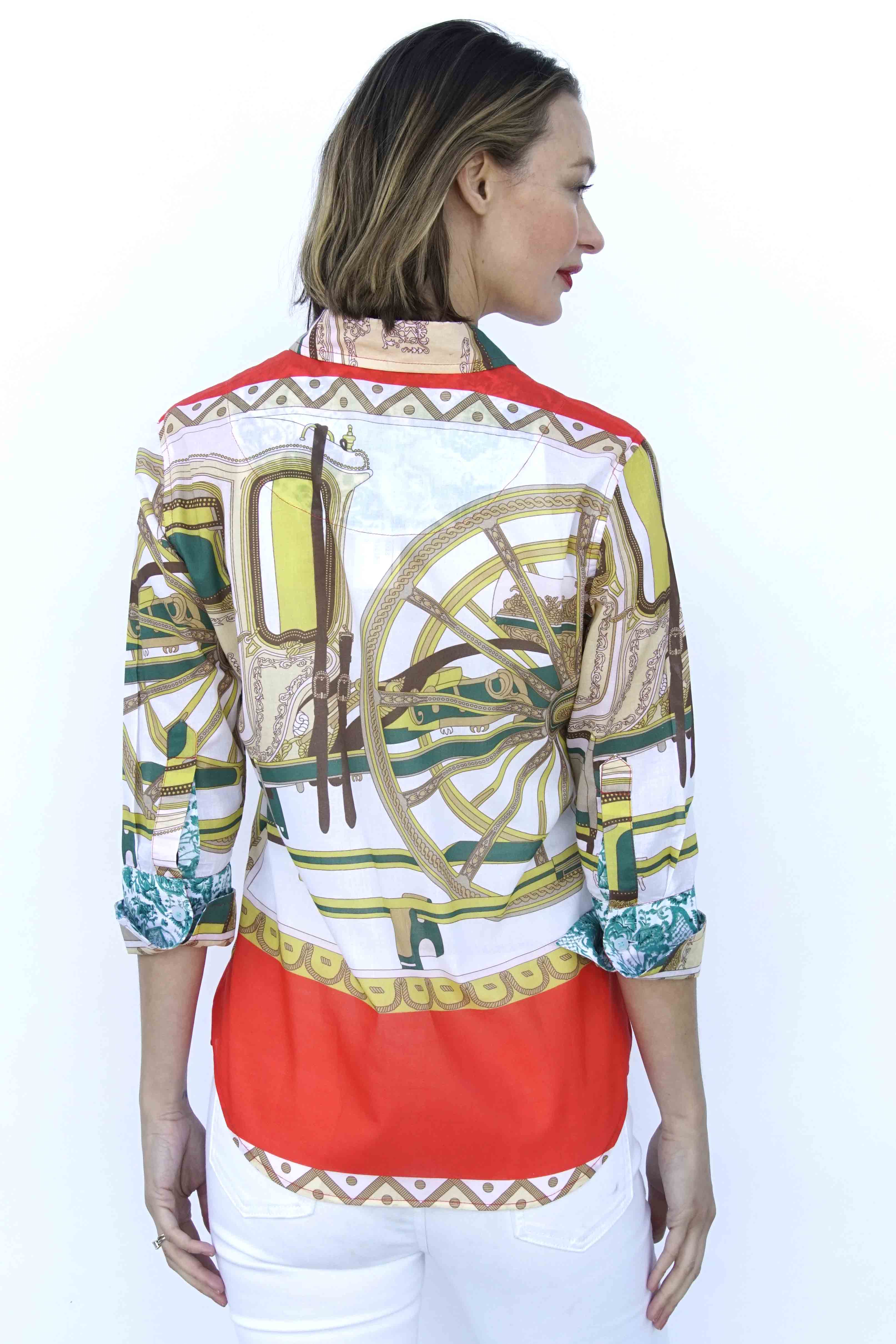 Dizzy-Lizzie 3/4 sleeve shirt featuring a melon and chartreuse wagon wheel print on soft fabric.
