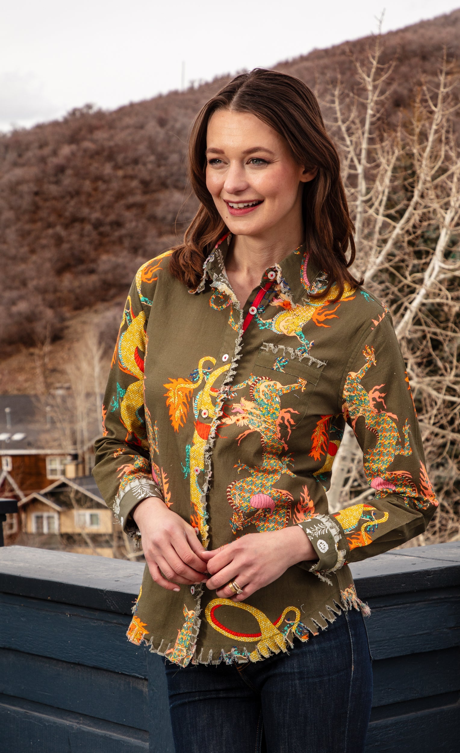 Olive green Dizzy-Lizzie Dragon Cape Cod shirt with long sleeves and relaxed fit, shown on a model.