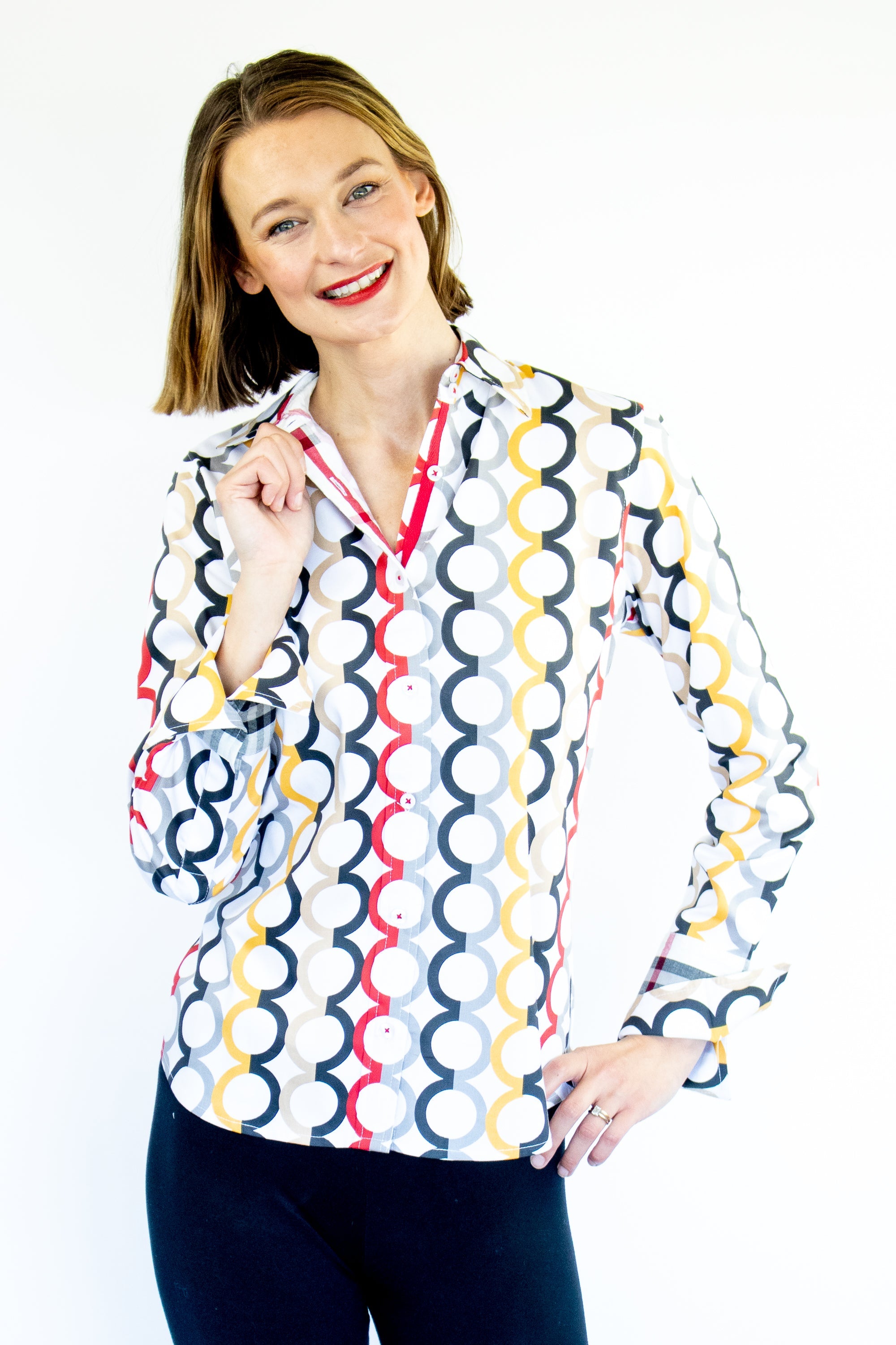 Dizzy-Lizzie Rome Shirt with fall colors and Olympic ring print, featuring vibrant autumn-inspired design and casual fit.