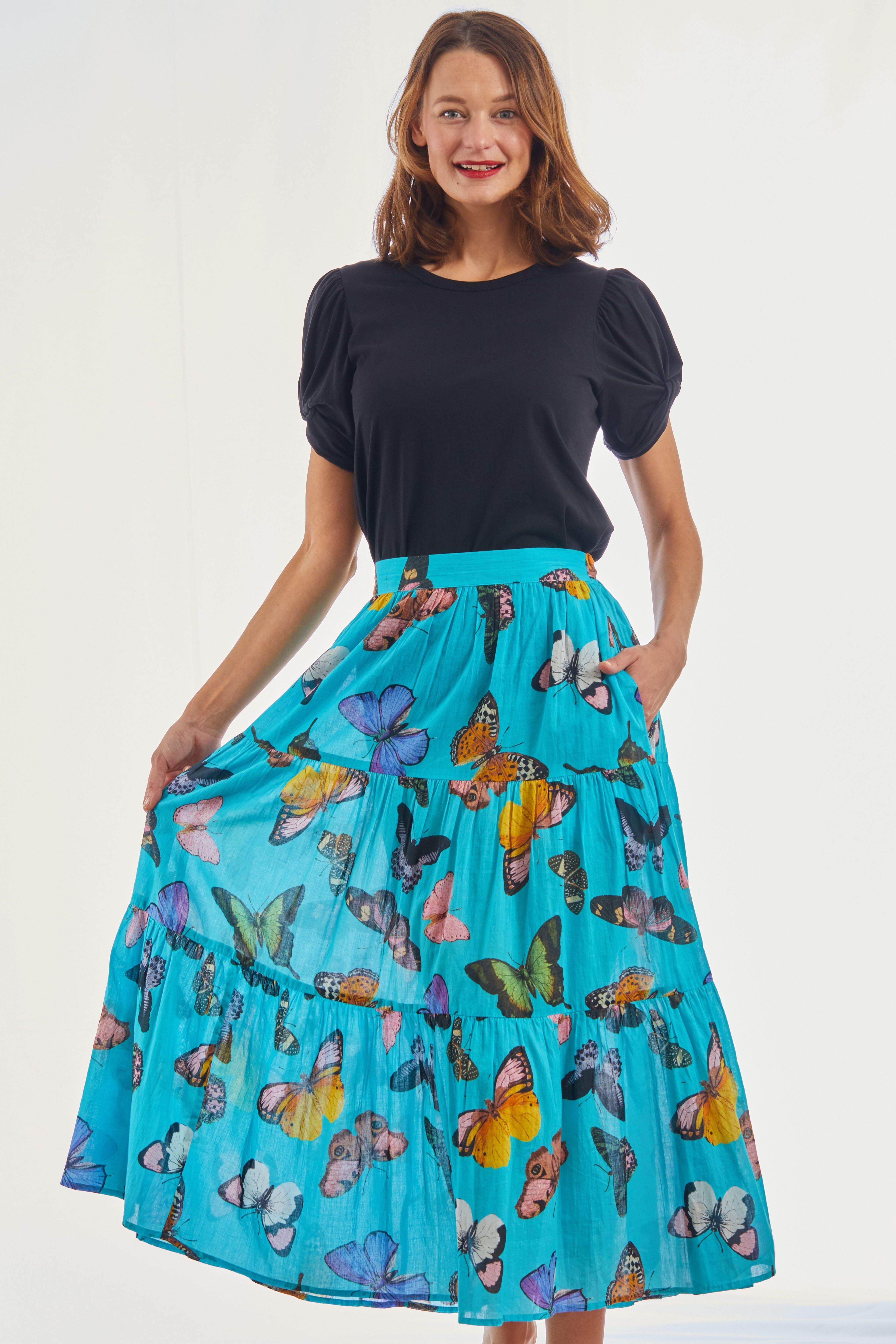 Woodstock turquoise butterfly print pull-on flounce skirt by Dizzy-Lizzie, featuring a flowy design and elastic waistband.