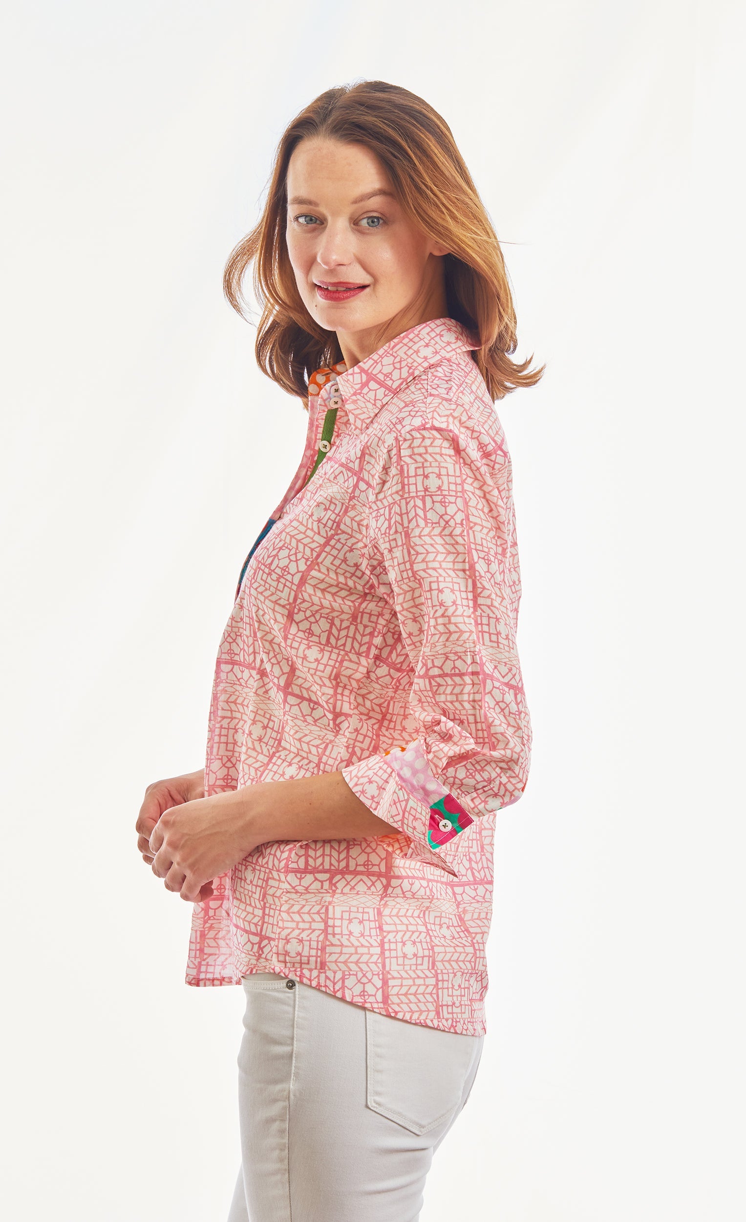 Pink 3/4 sleeve geometric print voile top by Dizzy-Lizzie with tiny pattern and relaxed fit, shown on a hanger.