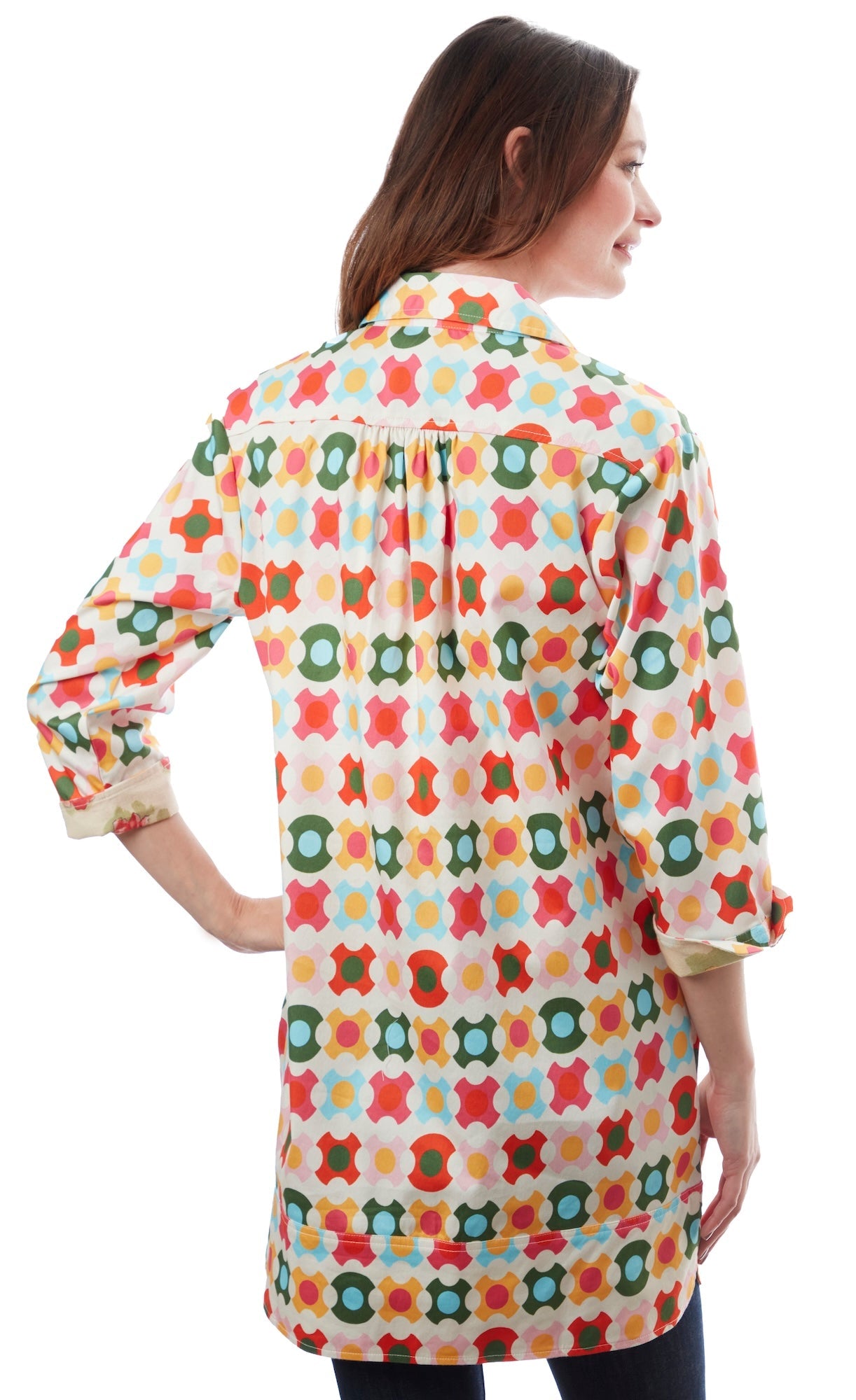 Colorful geometric patterned Vail Tunic by Dizzy-Lizzie featuring vibrant shapes and comfortable fit, displayed on a hanger.