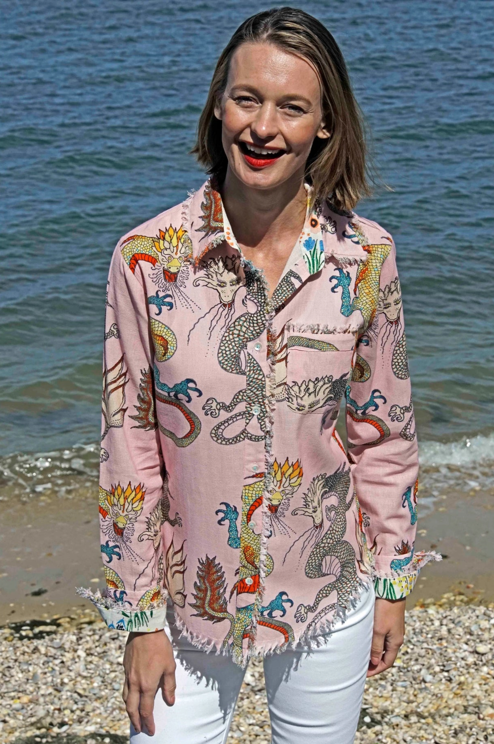 Pink ground dragons design on a Dizzy-Lizzie Cape Cod Tunic, lightweight and comfortable for casual wear.