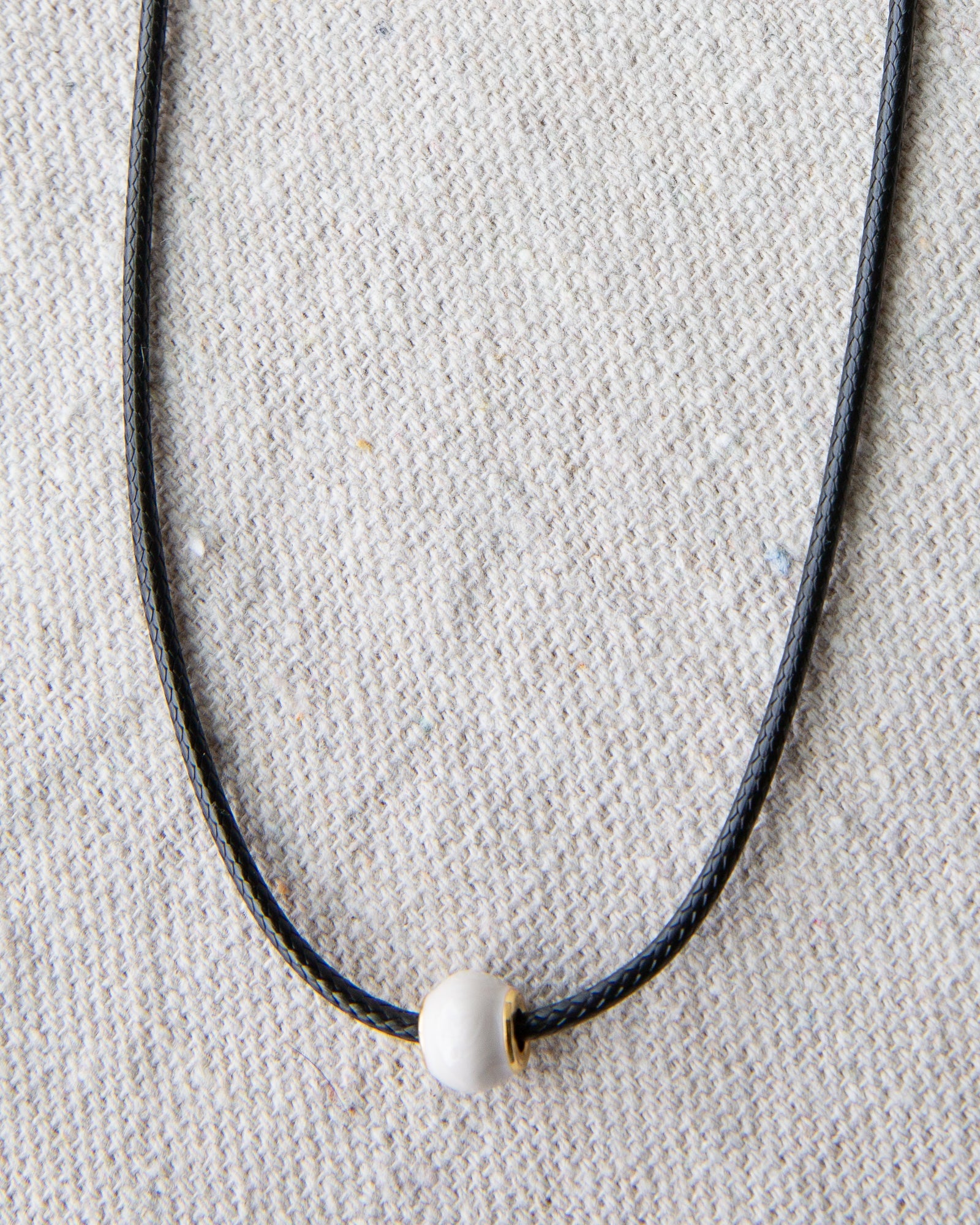 Downeast pearl and cord necklace featuring elegant white pearls on a stylish cord, perfect for casual or dressy occasions.
