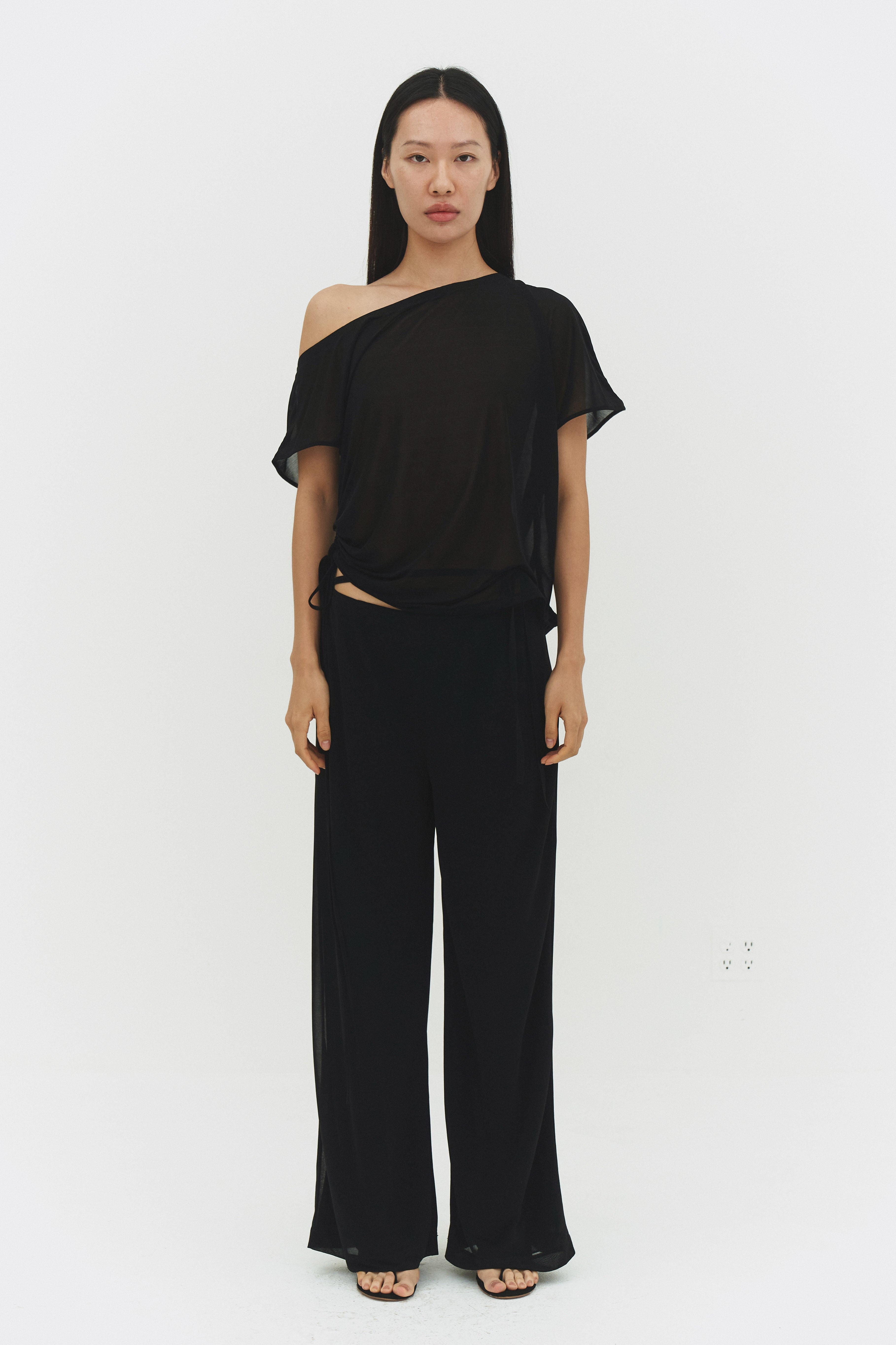 Black BRISA top by findmenowthelabel, showcasing a stylish sleeveless design with a fitted silhouette and minimal detailing.