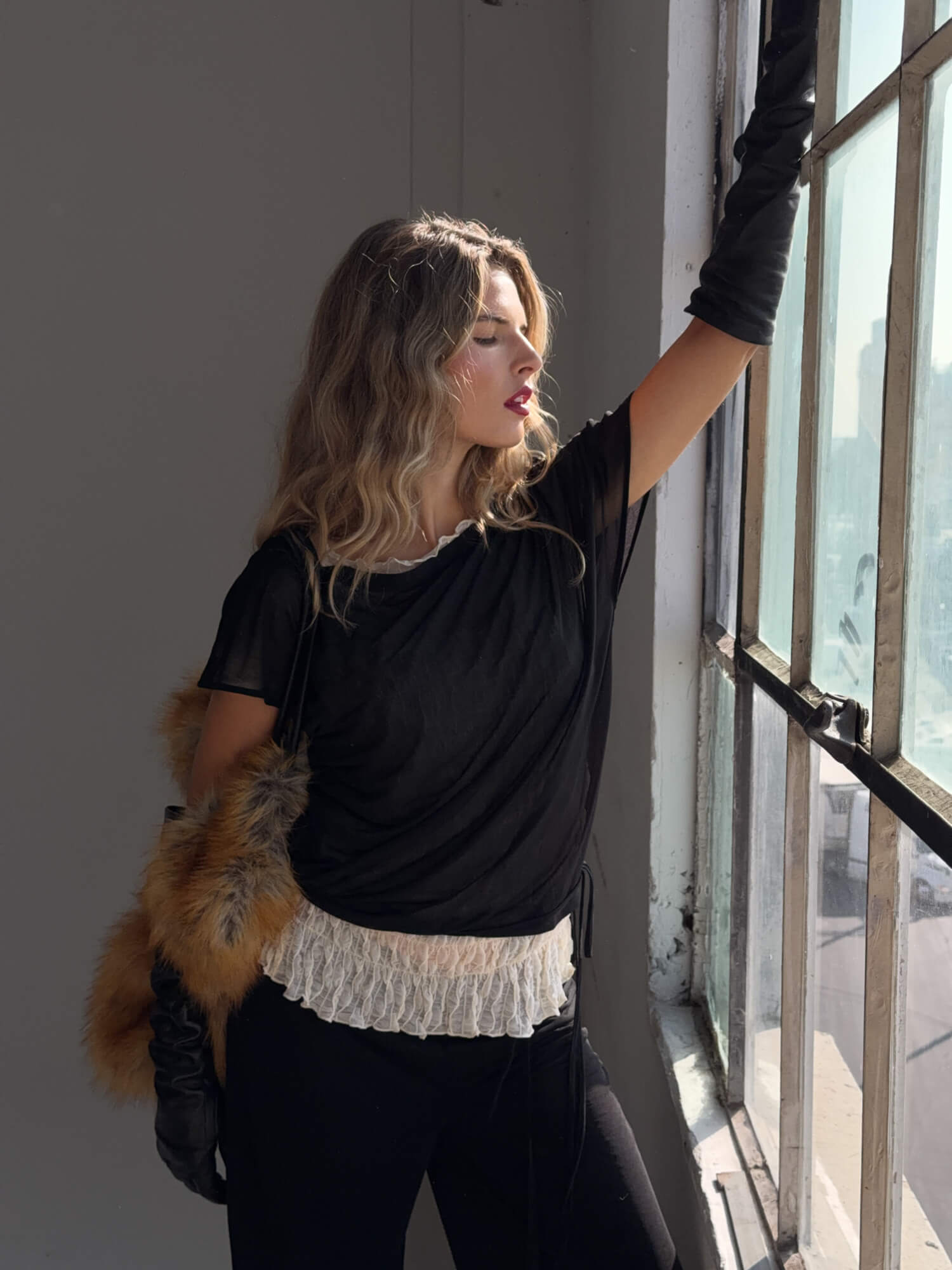 Black findmenowthelabel BRISA top displayed on a hanger, featuring a stylish sleeveless design and soft fabric.