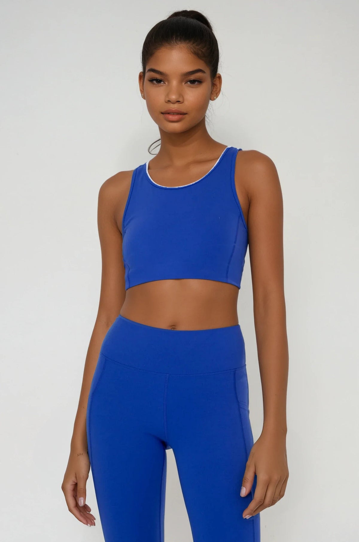 Blue Breathe Easy cut-out back sports bra by Fitkitty Culture, made with Lycra® blend, designed for active yoga and workout wear.