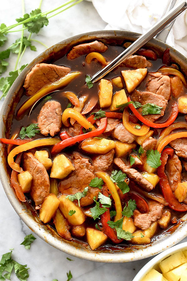 Igotchu Pork Chop seasoning jar with spice blend for flavorful grilled or fried pork chops, featured on a wooden surface