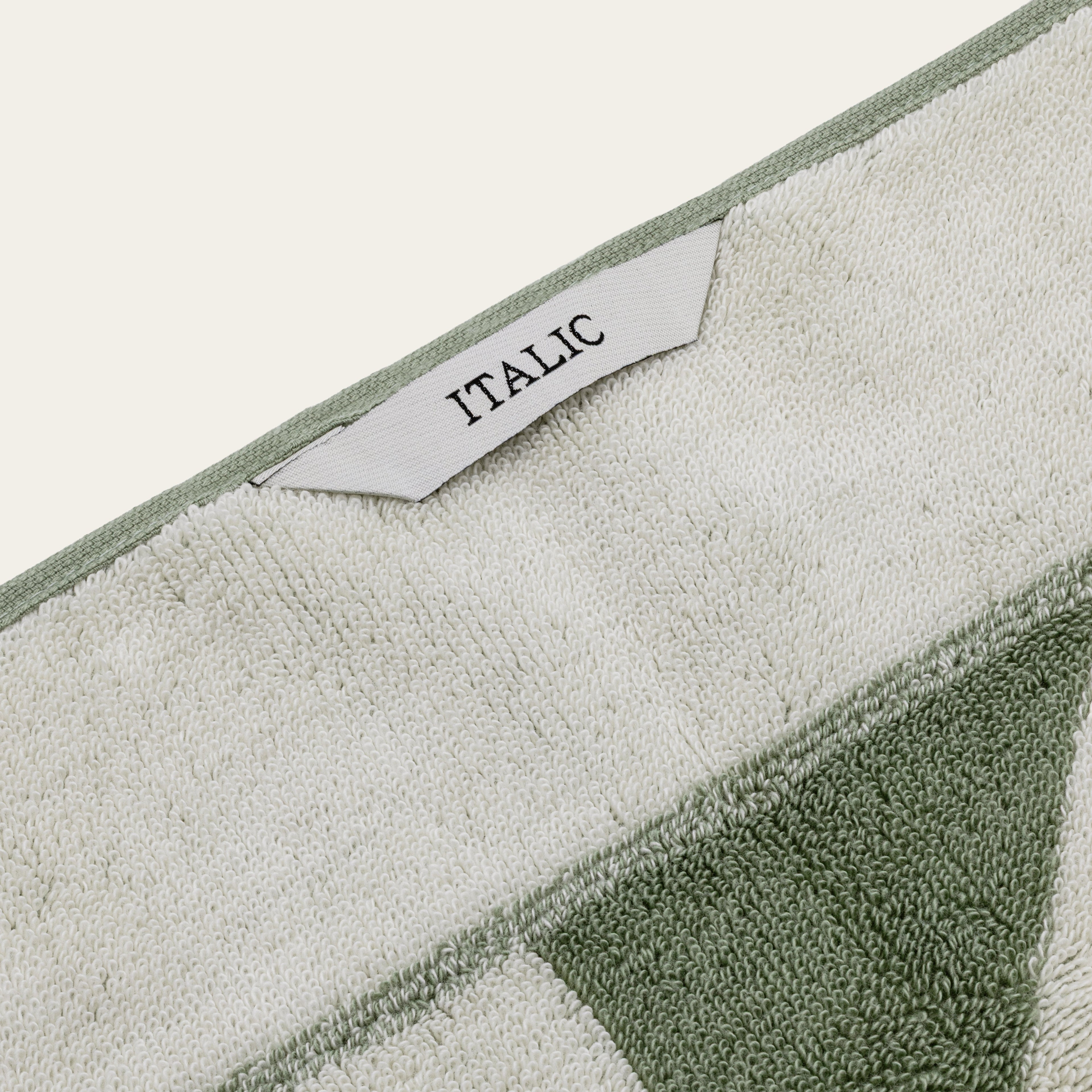 Italic Umbra Australian Cotton Bath Towel with plush texture and white color, displayed folded on a clean bathroom surface.