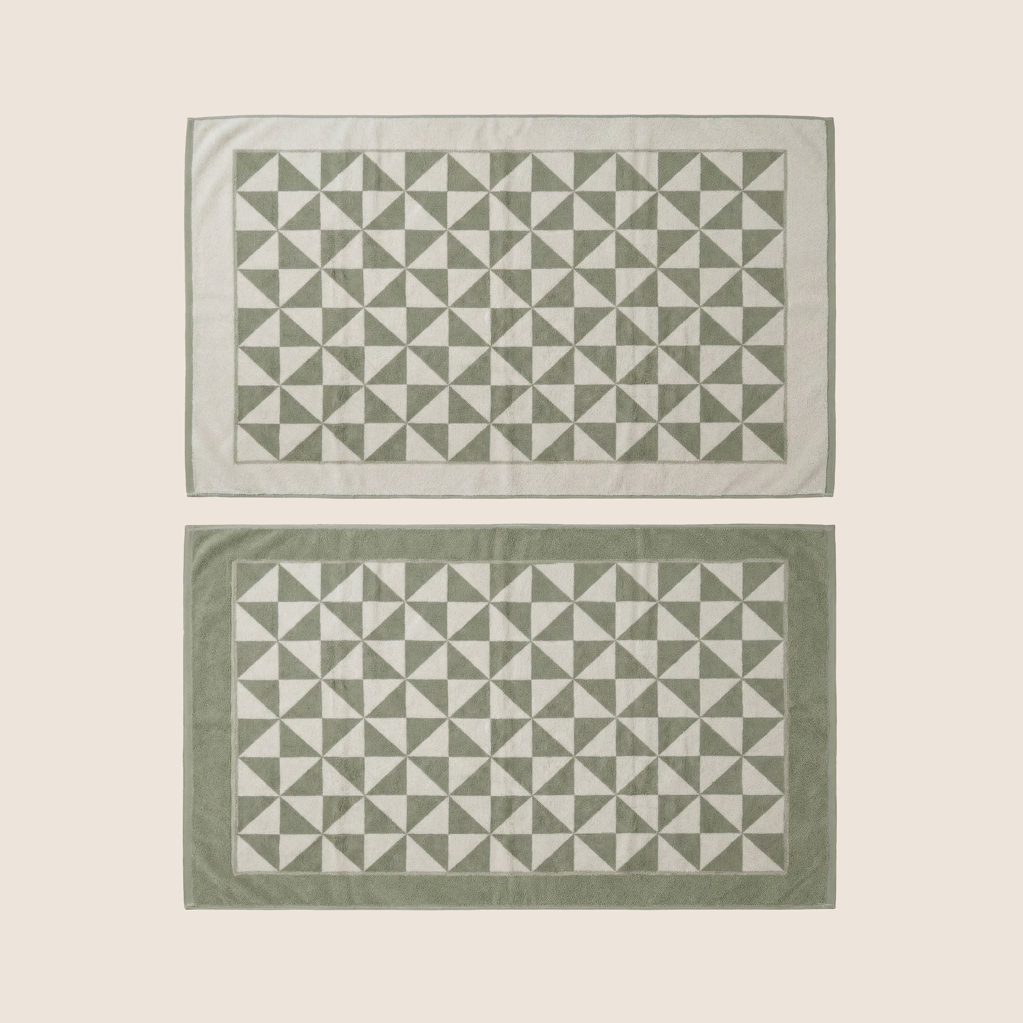 Umbra Australian cotton bath towels by Italic, flatlay image showing soft, plush, white towels perfect for bathroom use.