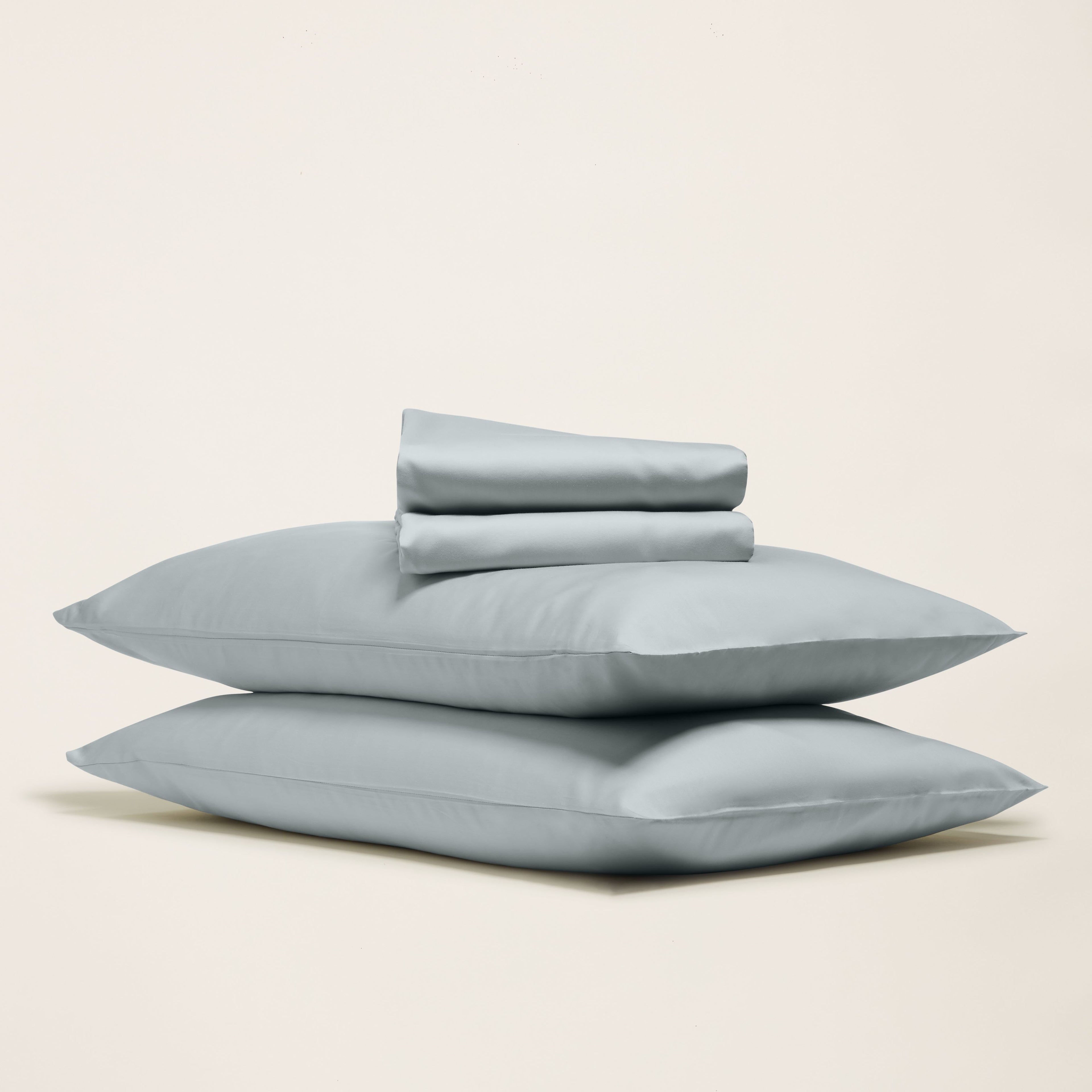 Italic Luxe Australian Sateen Sheet Set displayed on a bed with smooth, shiny, high-quality sateen fabric in a cozy home bedroom setting.