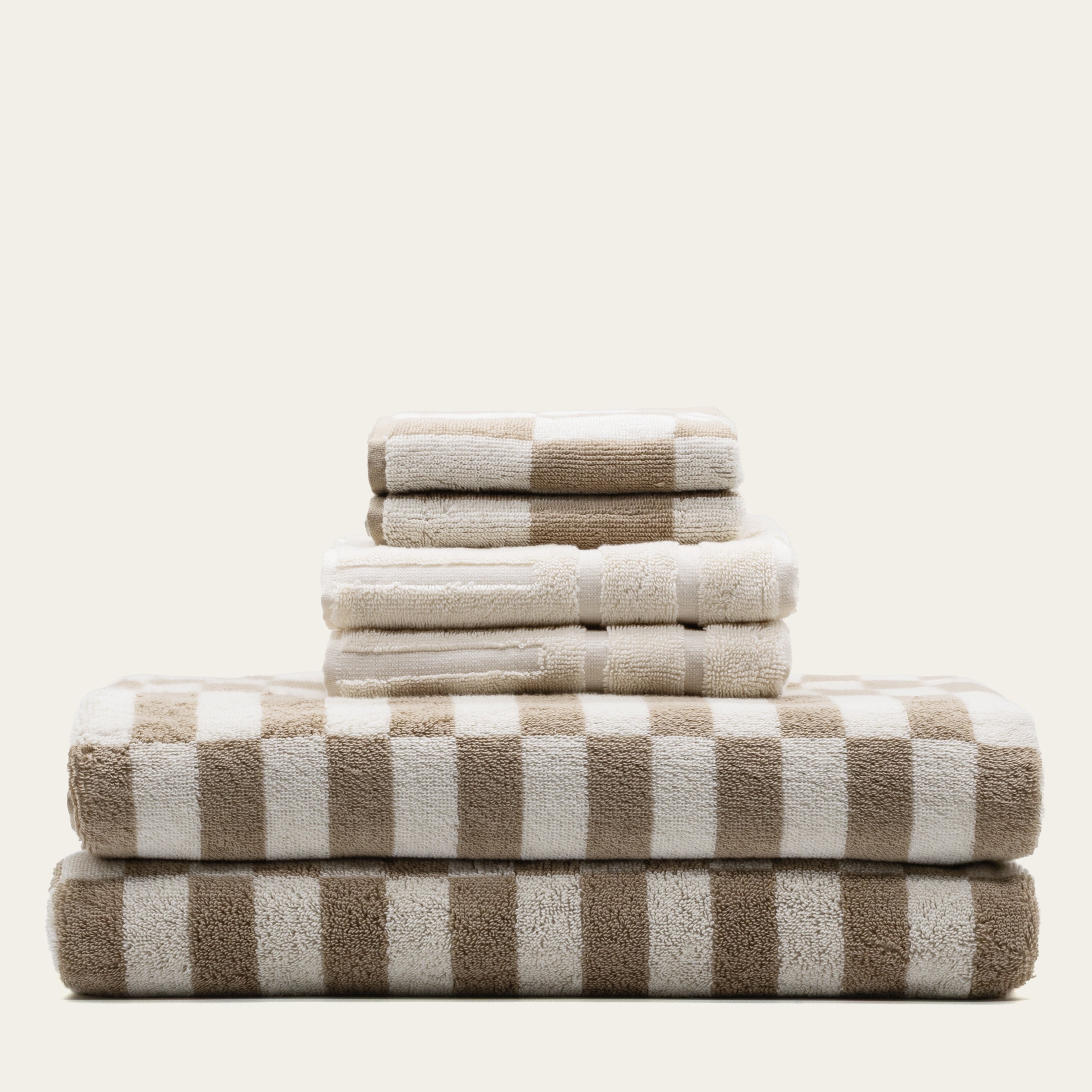 Luxurious Pietra Australian Cotton Towel by Italic, showing soft, plush white towel with textured weave and folded design.