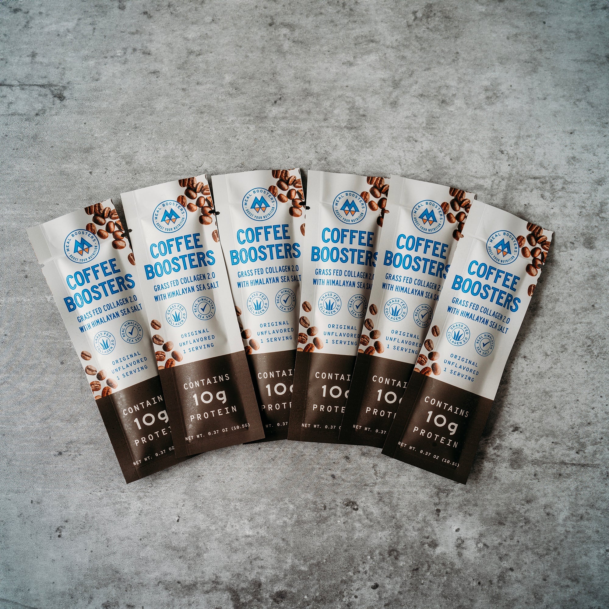 Unflavored collagen and electrolyte coffee booster packs from Meal Boosters, six single-serving sachets for added energy and hydration.