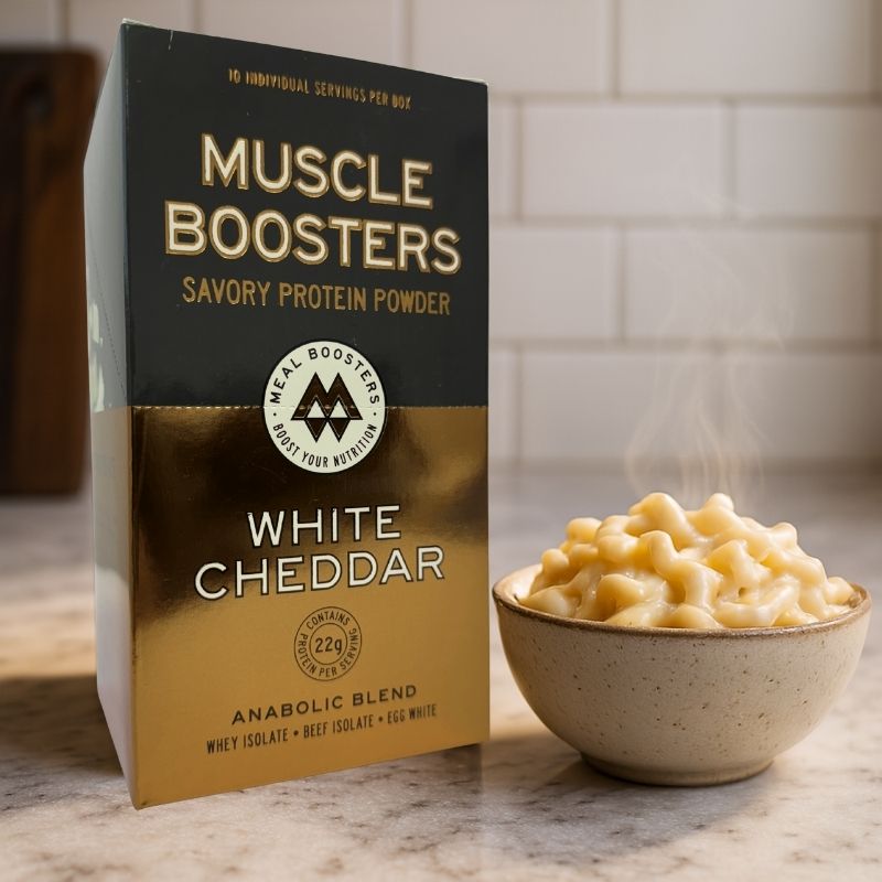 Organic grass-fed whey protein isolate Muscle Boosters White Cheddar protein powder box with 10 single serve packs, ideal for muscle support.