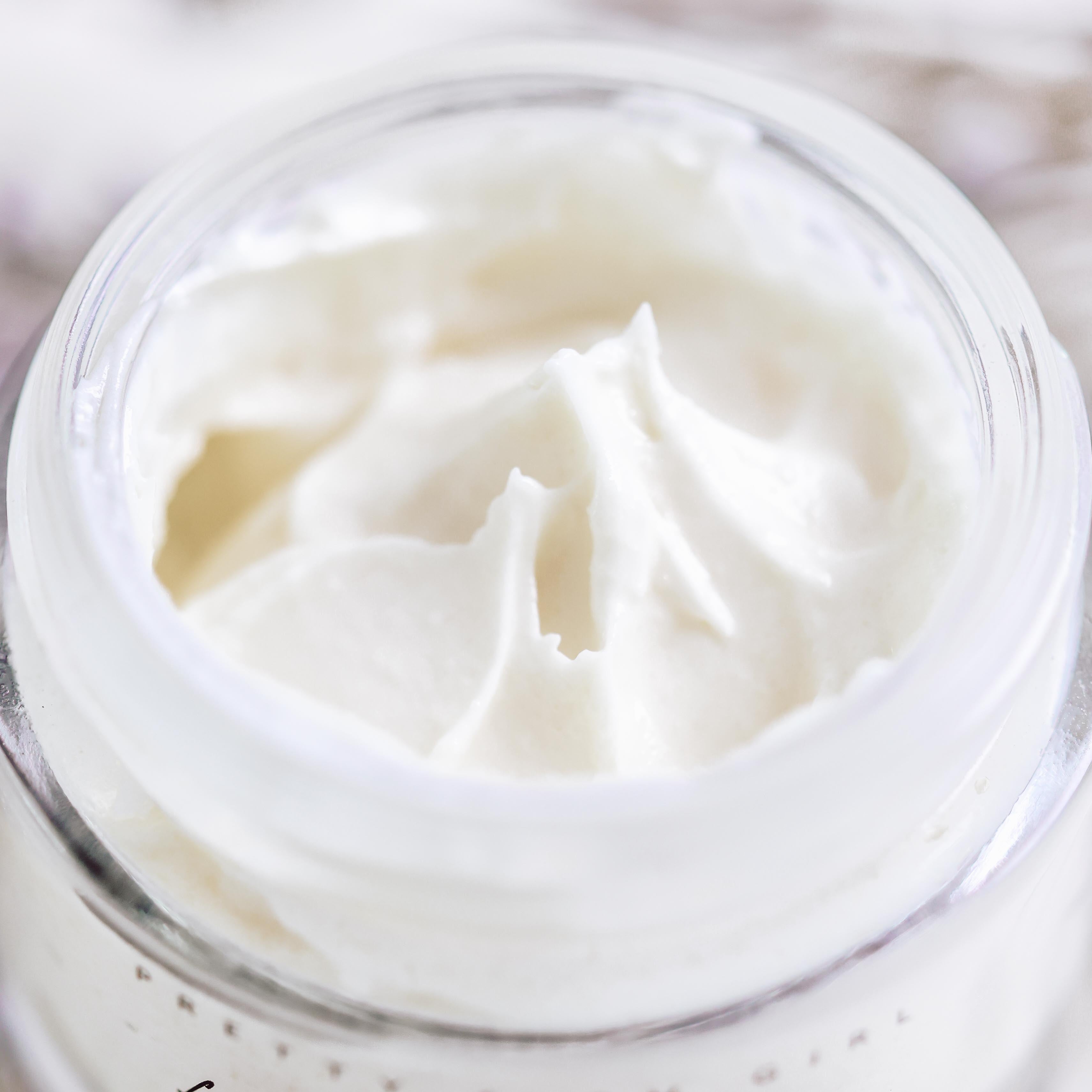 Cream jar of Pretty Farm Girl Fresh Face Cream Anti-Aging Tallow Moisturizer with a smooth, creamy texture visible in the image.