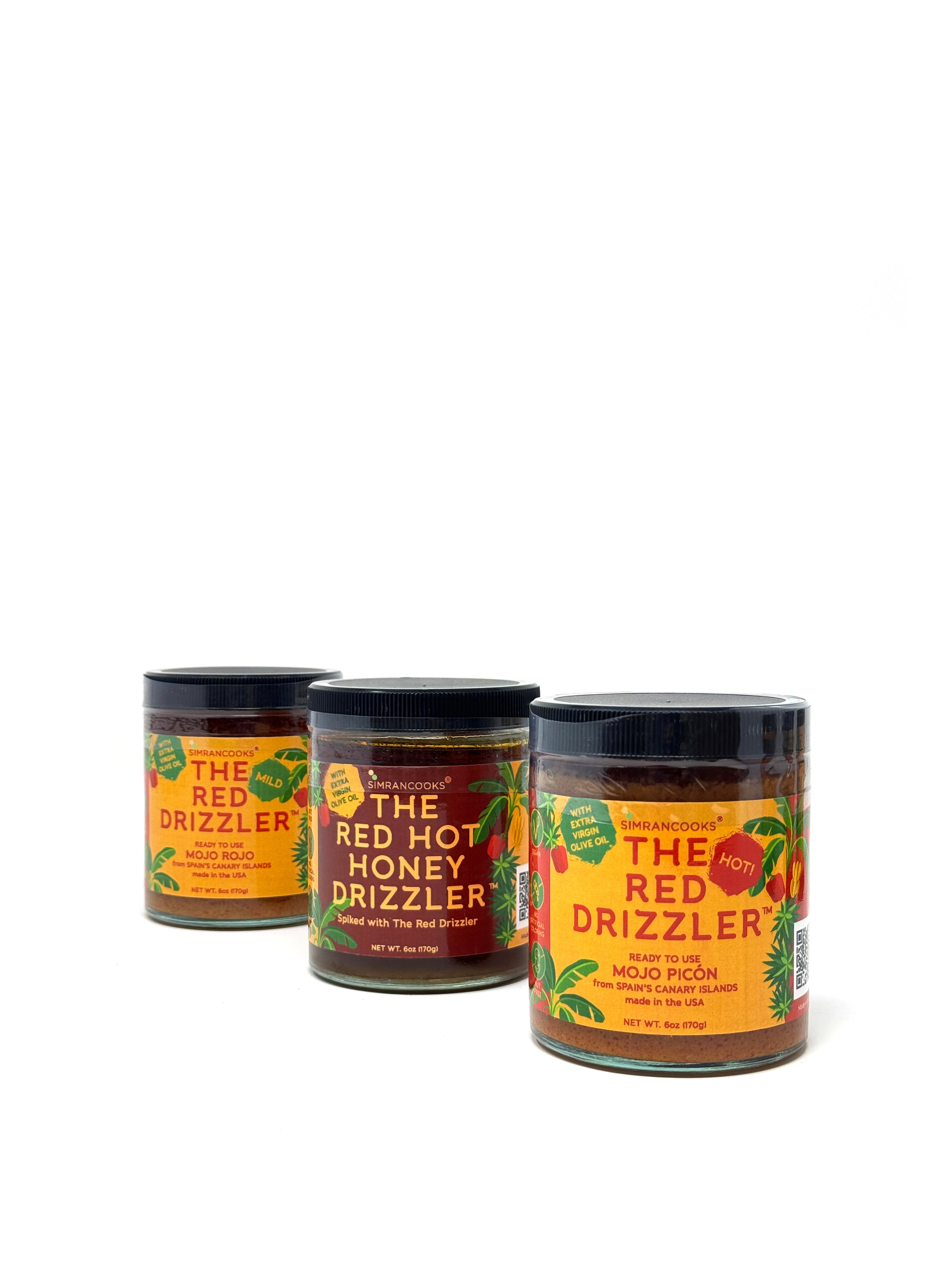 Set of three red drizzle bottles from Simrancooks, featuring sleek design and precise pour spouts for cooking and garnishing.