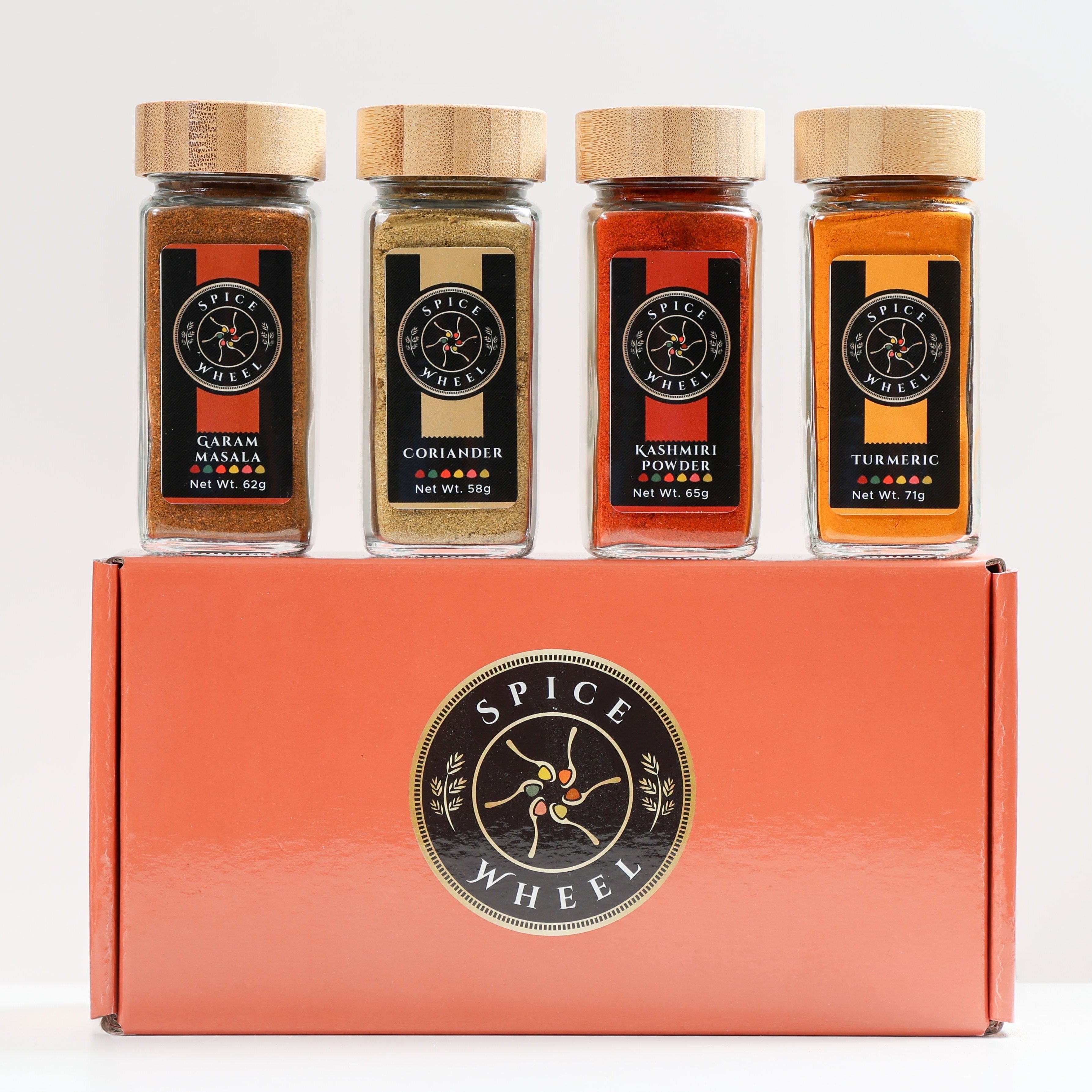 Indian Spice Gift Set with four spice jars from Spice Wheel, featuring colorful packaging and a variety of authentic Indian spices.