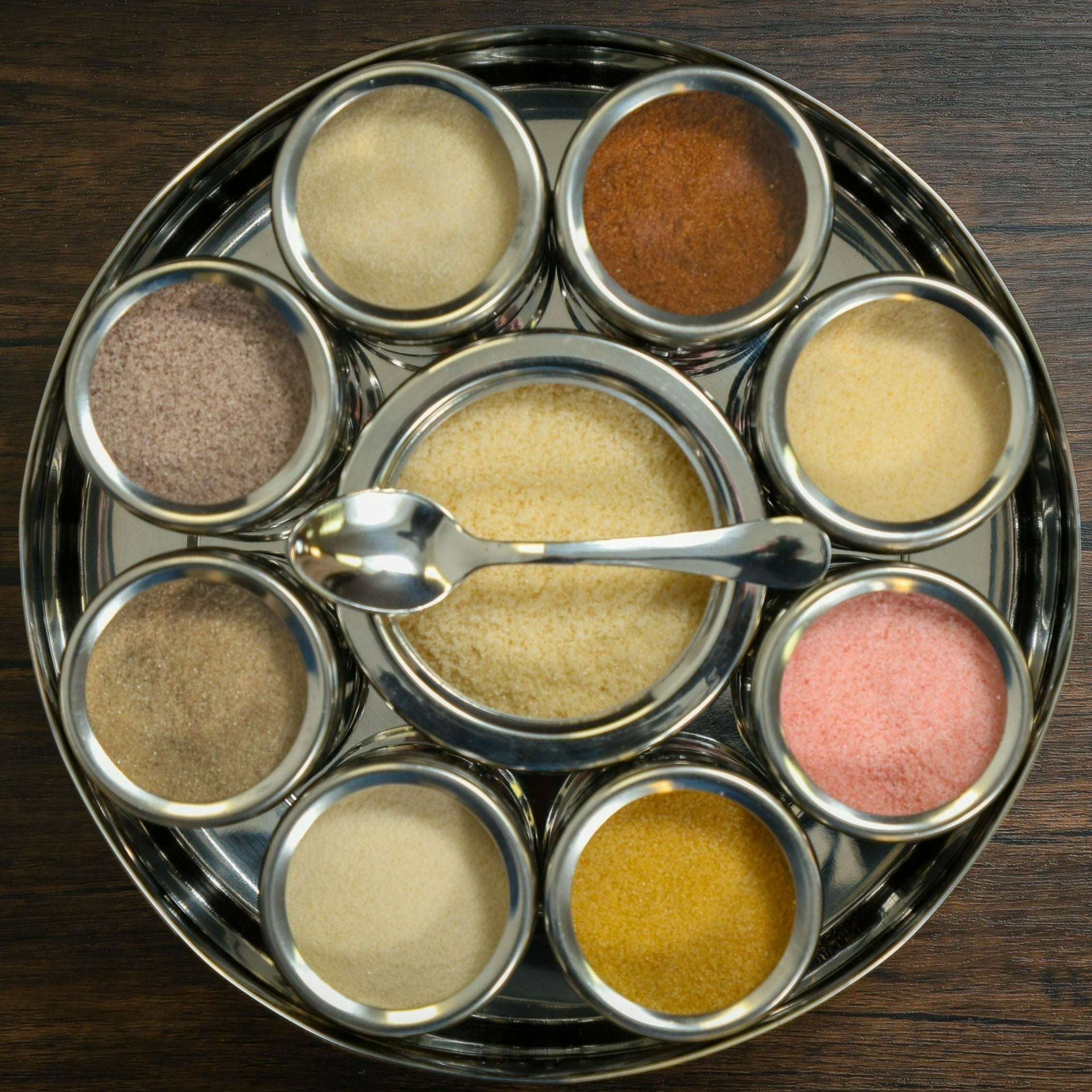 Colorful Spice Wheel with flavored sugar spices, showcasing a circular display of various seasonings on a Spice Wheel brand product.