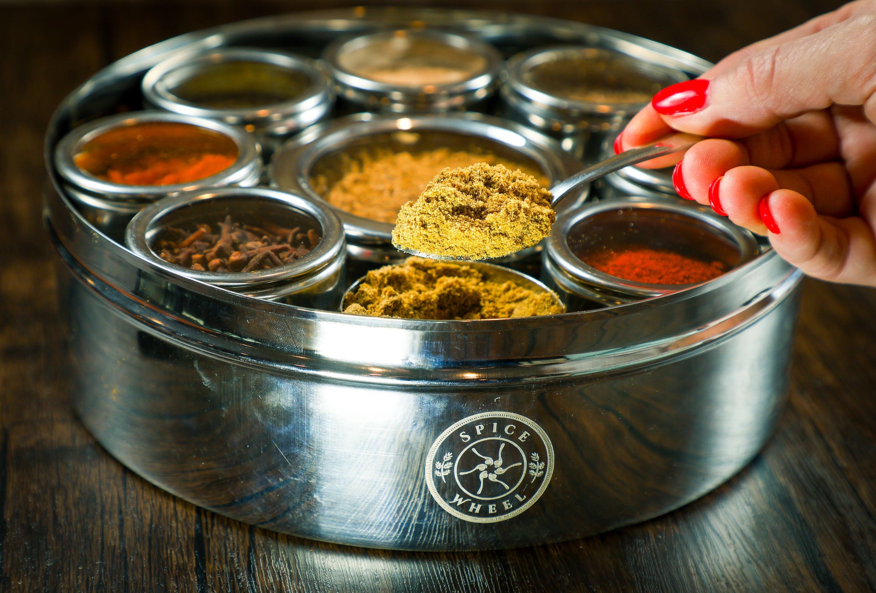 Mexican Spice Wheel displaying colorful spice segments on a round spice wheel for cooking and flavoring.