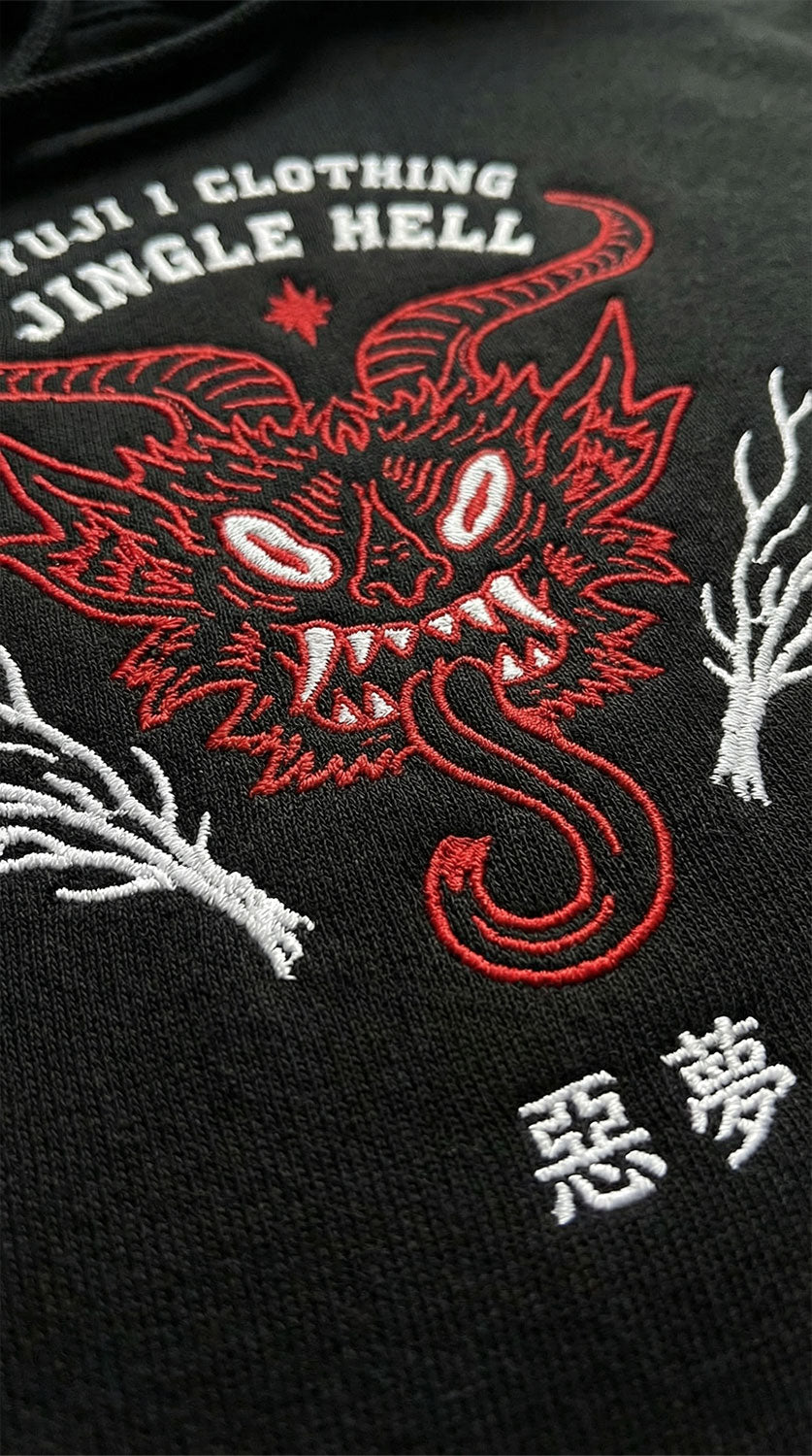 Yūjin Clothing Jingle Hell Christmas hoodie featuring festive red and green fabric with holiday-themed jingle bell accents and cozy fit.