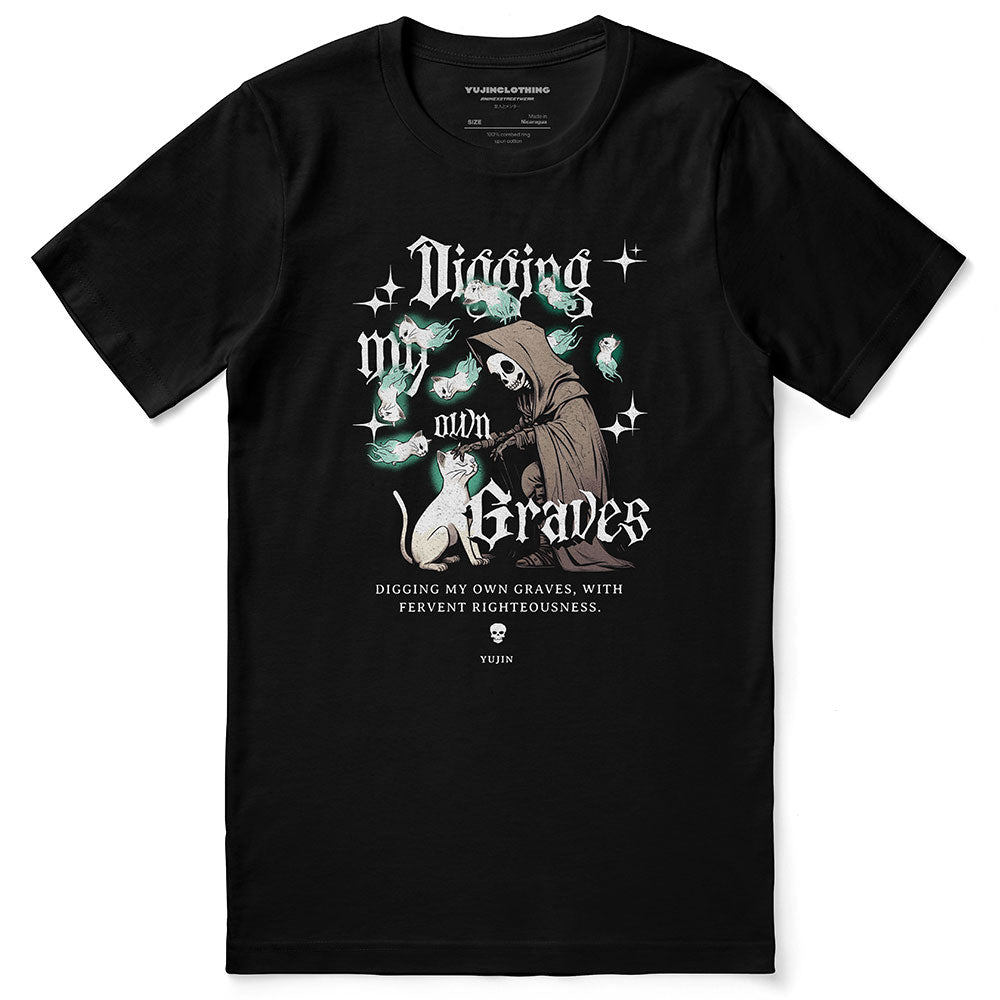 Yūjin Clothing Digging My Own Graves cat T-Shirt featuring a graphic of a cat digging with bold text on a black fabric background.