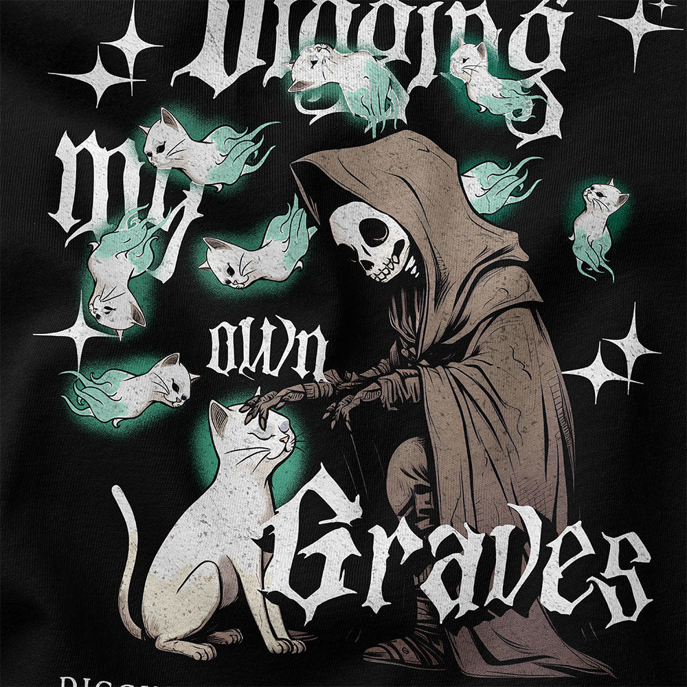 Yūjin Clothing Digging My Own Graves cat T-Shirt featuring a graphic design with a cat and edgy text on a black cotton tee.