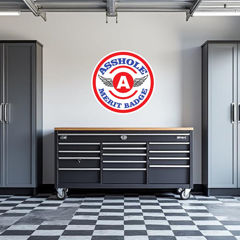 Asshole Merit Badge Garage wall decal from Armed American Supply, featuring a humorous badge design on a garage wall.