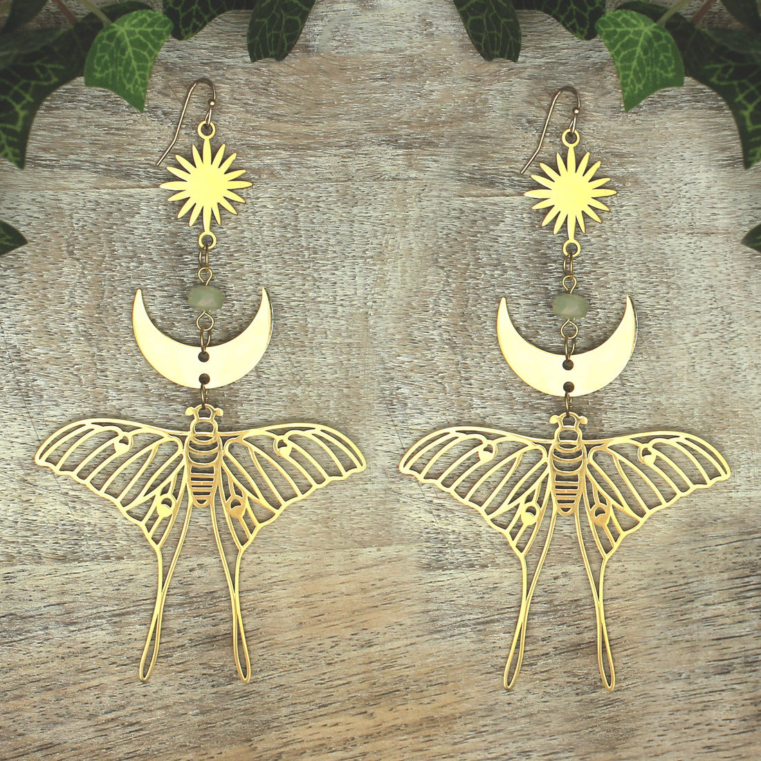 Celestial Luna Moth oversized gold earrings with intricate design, handcrafted jewelry accessory for women.