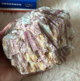Raw pink tourmaline gemstone from Evermore Everlasting showing its natural pink color and rough, unpolished texture.