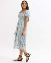 Downeast Fresh Bouquet Dress featuring a floral print, sleeveless design, and lightweight fabric perfect for summer wear.