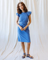 Downeast On Repeat Dress featuring a flowy silhouette, floral pattern, and short sleeves, perfect for casual or summer wear.