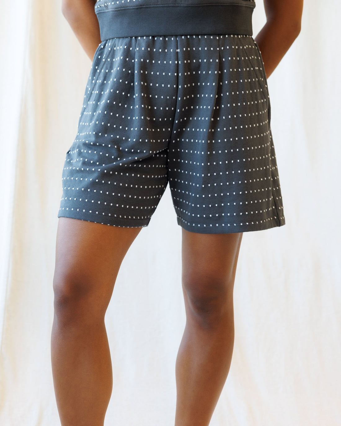 Downeast On Repeat Shorts, casual denim shorts with distressed details and rolled cuffs, displayed on a neutral background.