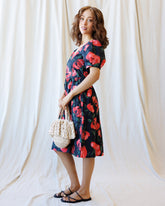 Downeast Signature Sun Dress displayed on a hanger, featuring a sleeveless design and lightweight fabric perfect for summer wear.