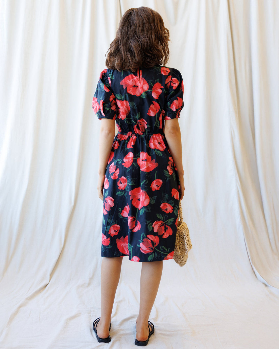 Downeast Signature Sun Dress featuring a lightweight, flowy fabric with a floral pattern and sleeveless design.