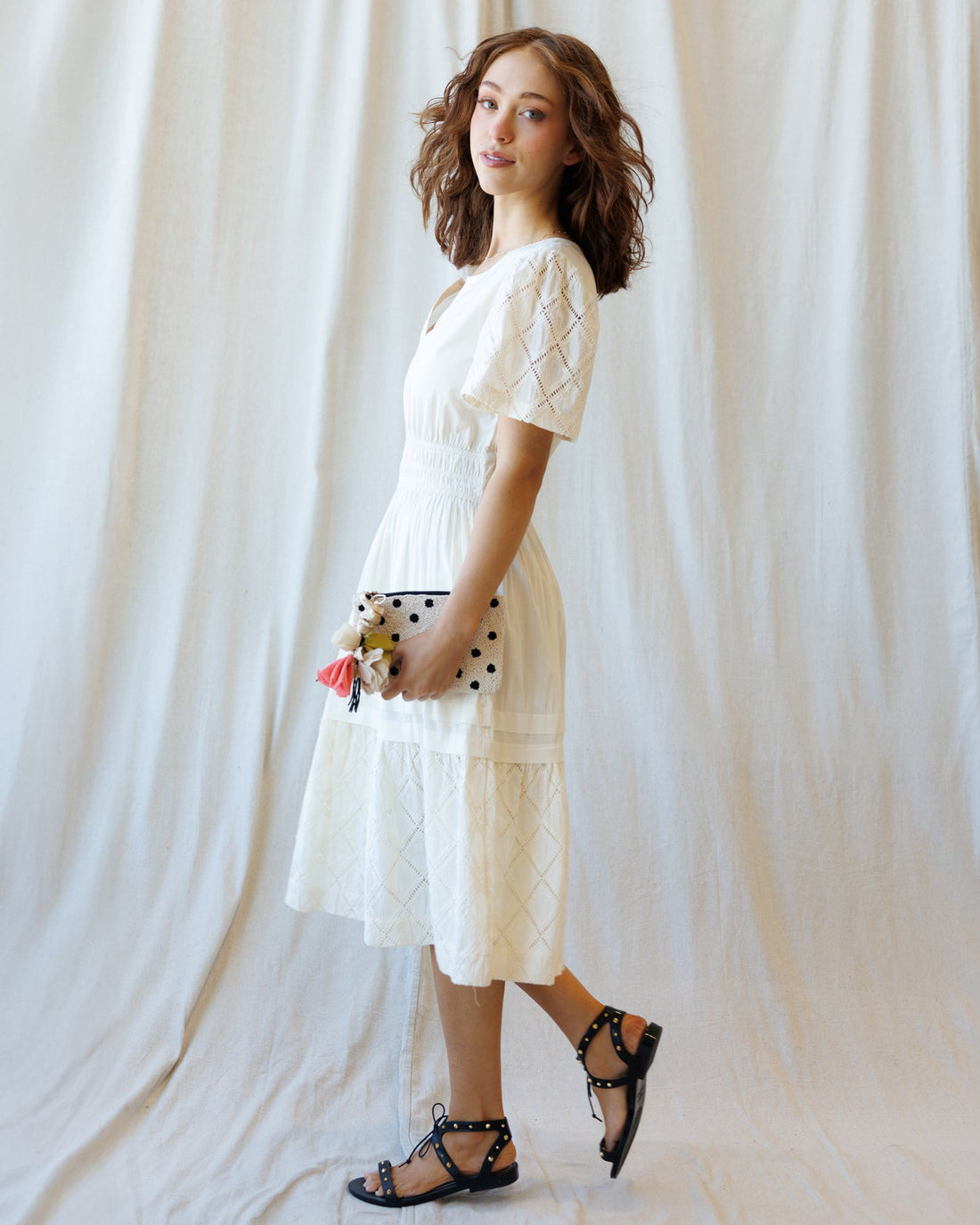 Downeast Icon Demi Lace Dress displayed on a hanger, showcasing intricate lace details and elegant design for women.