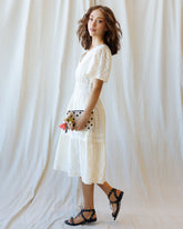 Downeast Icon Demi Lace Dress displayed on a hanger, showcasing intricate lace details and elegant design for women.