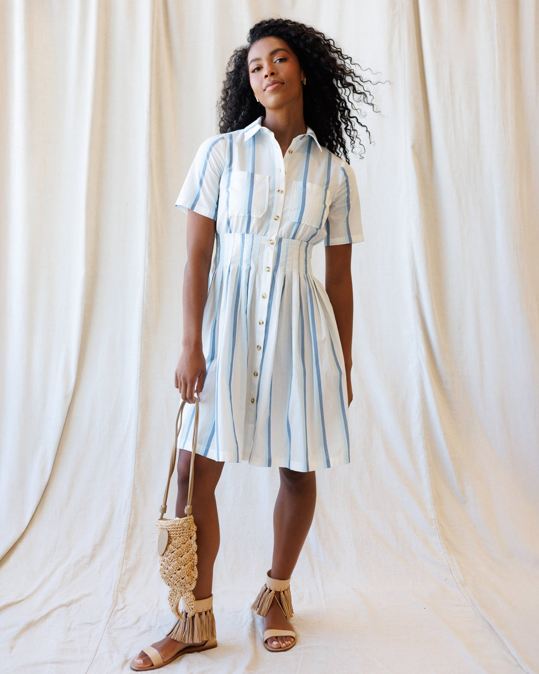 Downeast Seaside Stripe Dress with a fitted bodice and flowing skirt, featuring blue and white nautical stripe pattern.