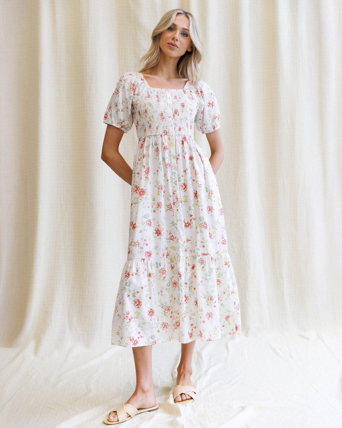 Downeast High Tea Dress, elegant floral dress with cinched waist and flowing skirt, perfect for daytime or special occasions.