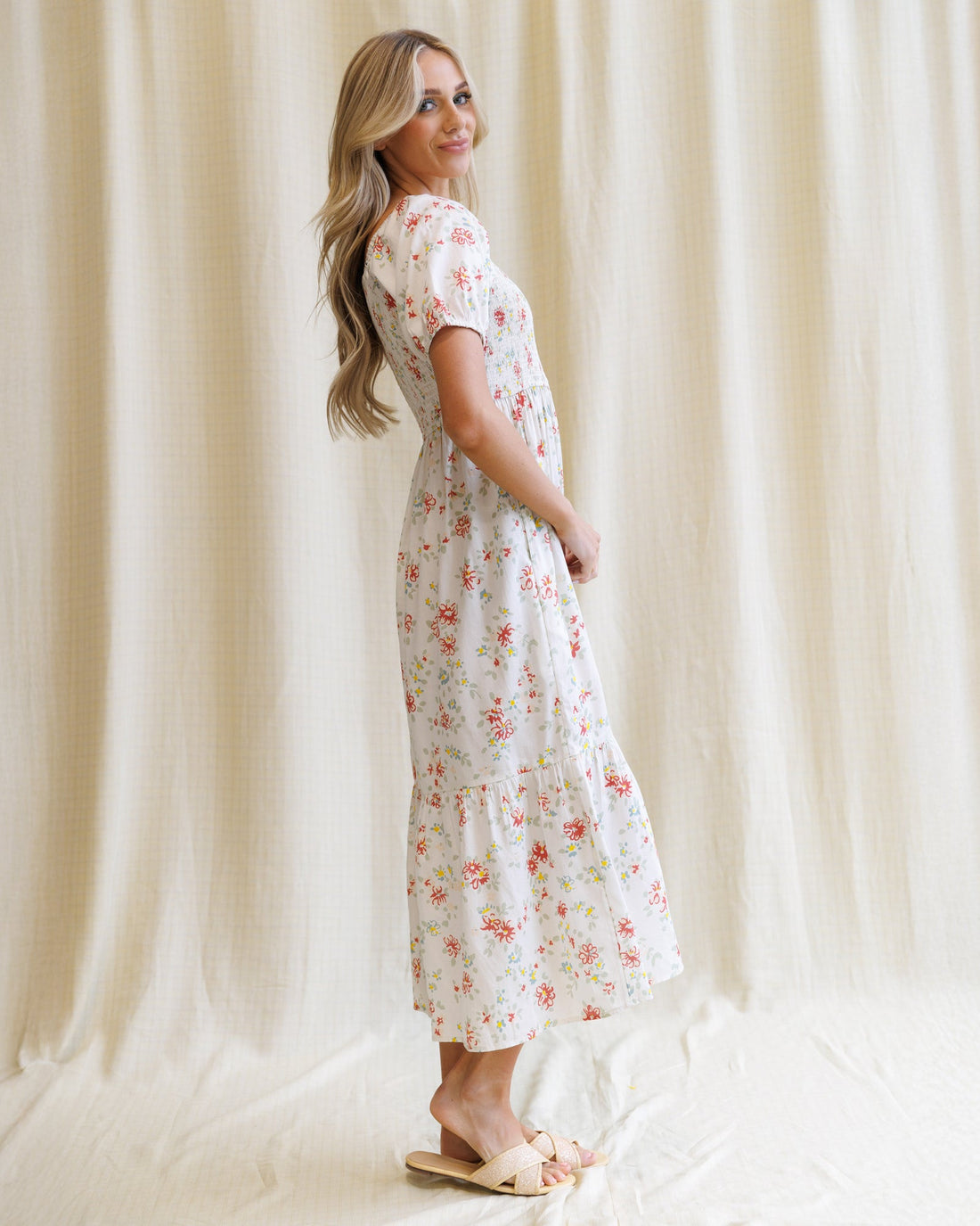 Downeast High Tea Dress featuring a floral pattern with a fitted bodice and flowing skirt, perfect for elegant occasions.