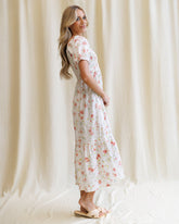 Downeast High Tea Dress featuring a floral pattern with a fitted bodice and flowing skirt, perfect for elegant occasions.