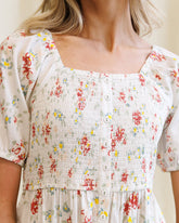Downeast High Tea Dress featuring a floral pattern, sleeveless design, and elegant fit perfect for spring and summer occasions.