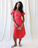 Downeast One Fine Day Dress displayed on a hanger, featuring a lightweight, flowy fabric with a floral pattern and feminine design.