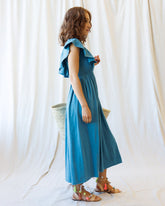 Downeast Sol Mate dress displayed on a hanger, featuring a flowy, casual design with vibrant patterns and lightweight fabric.