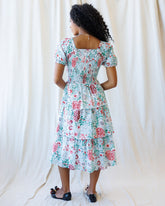 Downeast complimentary colors dress displayed on a hanger, featuring vibrant fabric and a stylish, casual design.